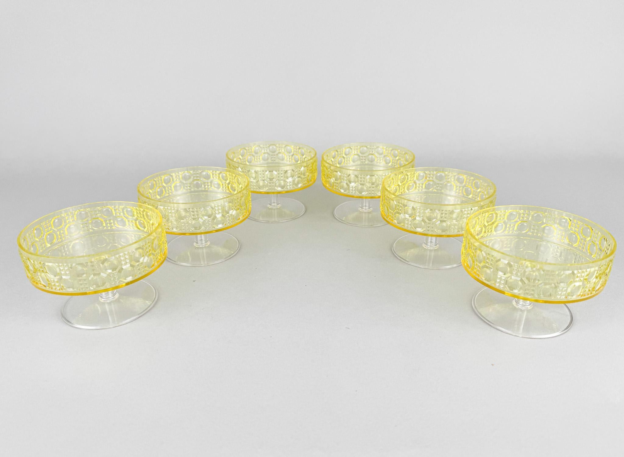 Set of six mid-century yellow plastic ice cream cups. Made in Germany in the 1960's.