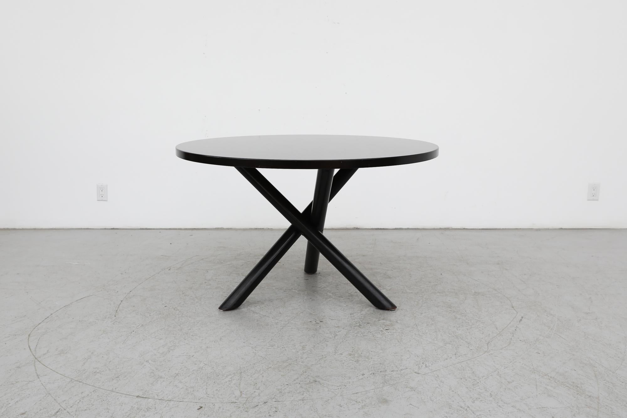 Beautiful Mid-Century black lacquered dining or center table designed by Dutchman Gerard Geytenbeek and made by Zwijnenburg in the 1960s.  The 