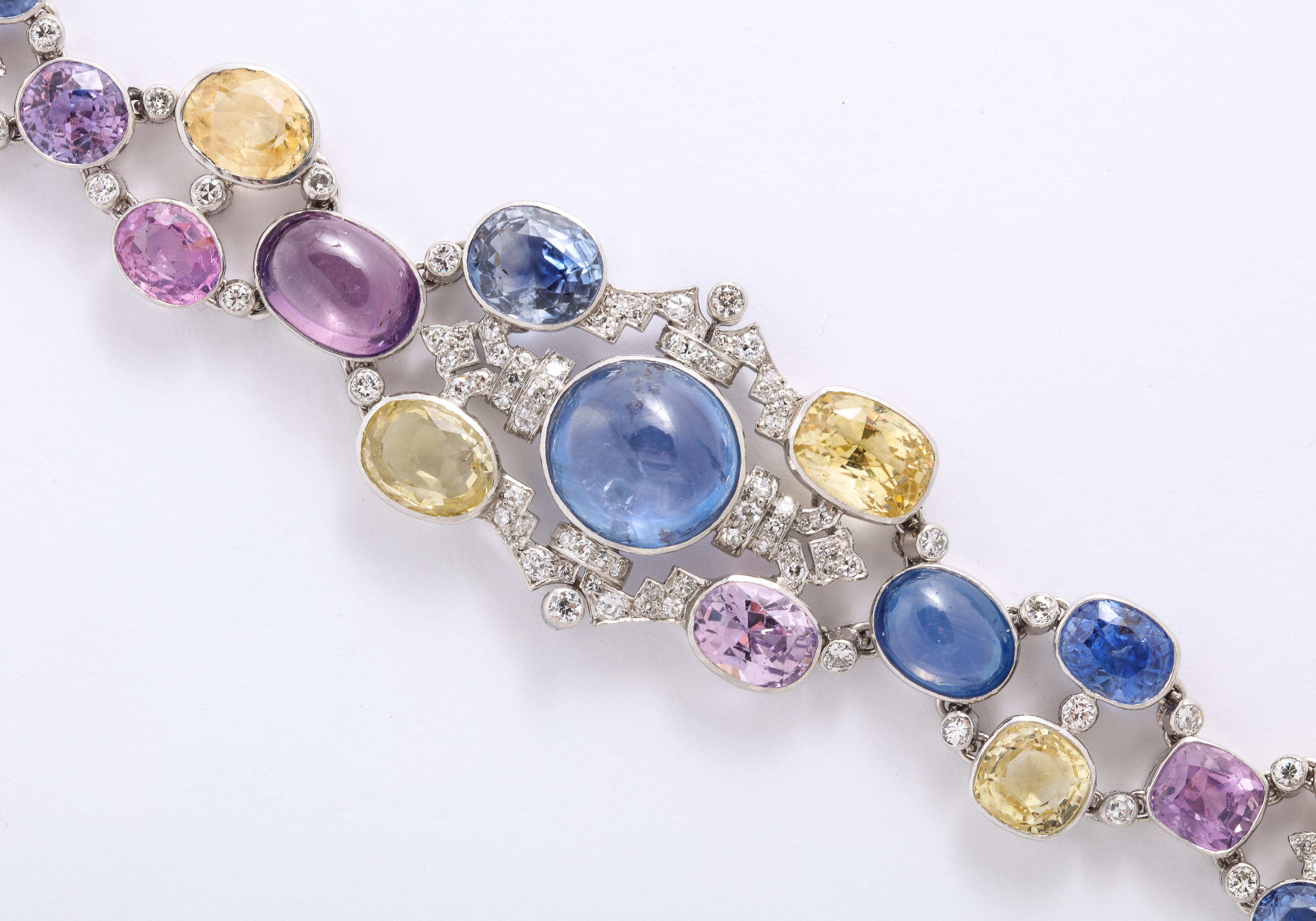 1960's Important Made wide Multi Colored Sapphire with Diamond Bracelet, comprising of Yellow, Blue, Purple, Pink Sapphires, with a center Blue Cabochan  12 Carat Star Sapphire. 

Im Surprised this piece isn't signed by an important Jeweler,