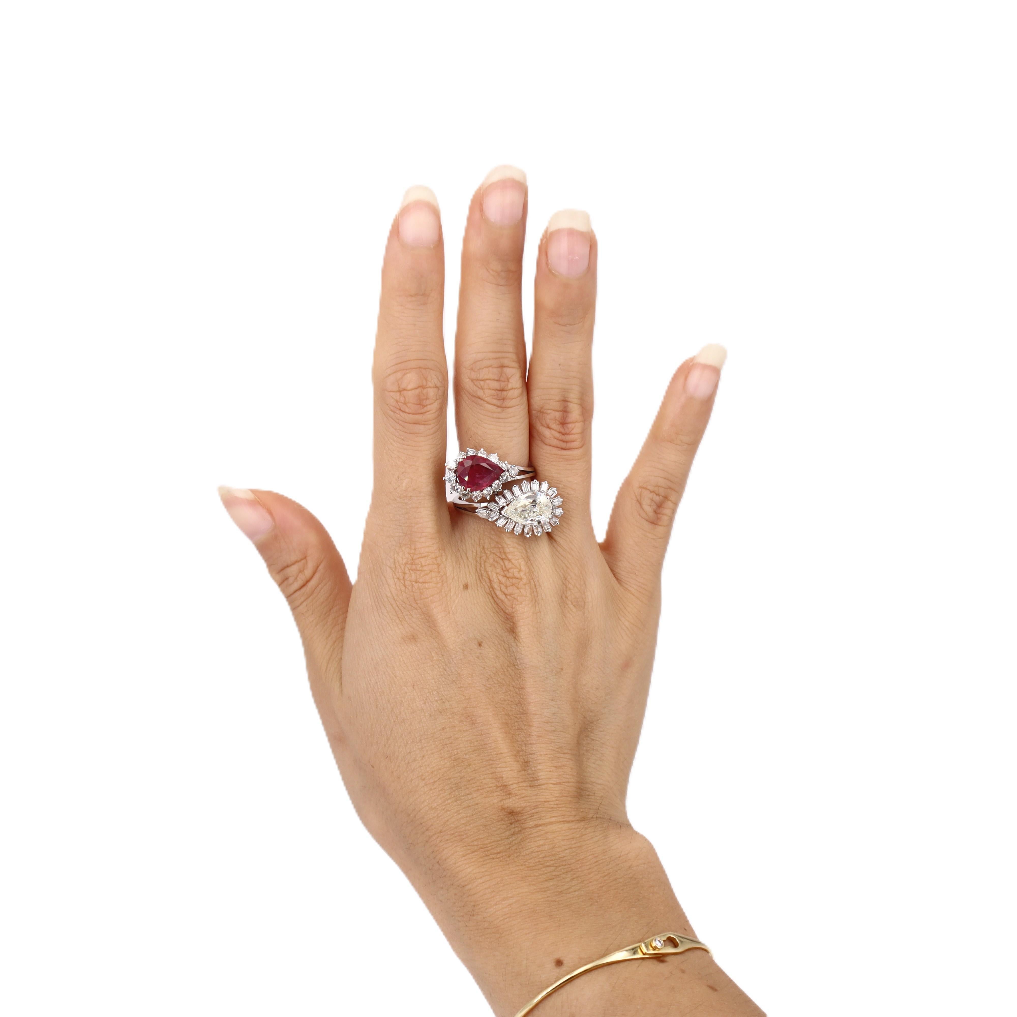 This extraordinary 1960's cocktail ring showcases the bold glamour of mid-century design with a stunning pear-shaped diamond and vibrant ruby centerpiece. Crafted in lustrous platinum, this statement piece features over 30 additional diamonds
