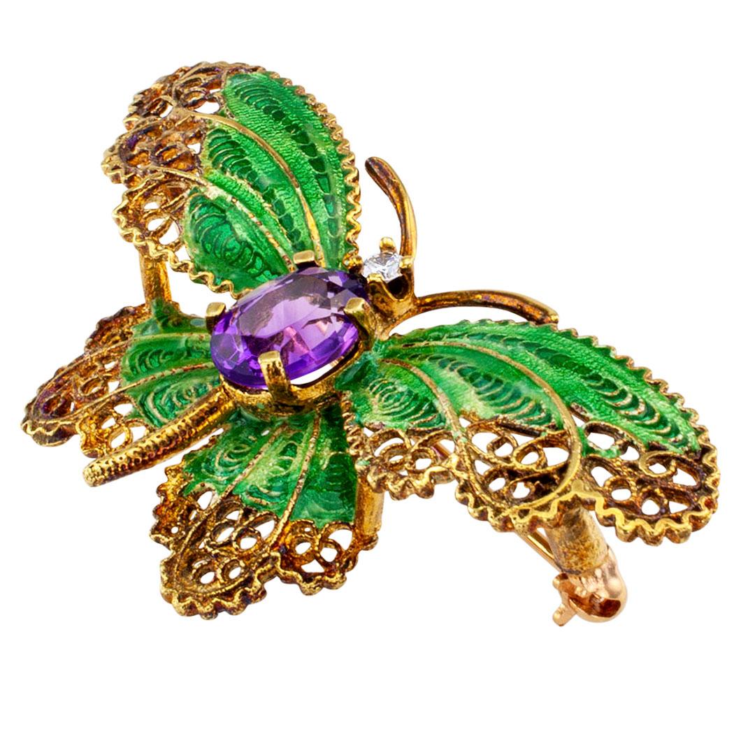 1960s plique a jour enamel amethyst and diamond butterfly gold brooch. The lacy butterfly wings have been applied with green plique a jour enamel, between a rich color amethyst and a diamond set at the head of the butterfly. It is magical! Enriched