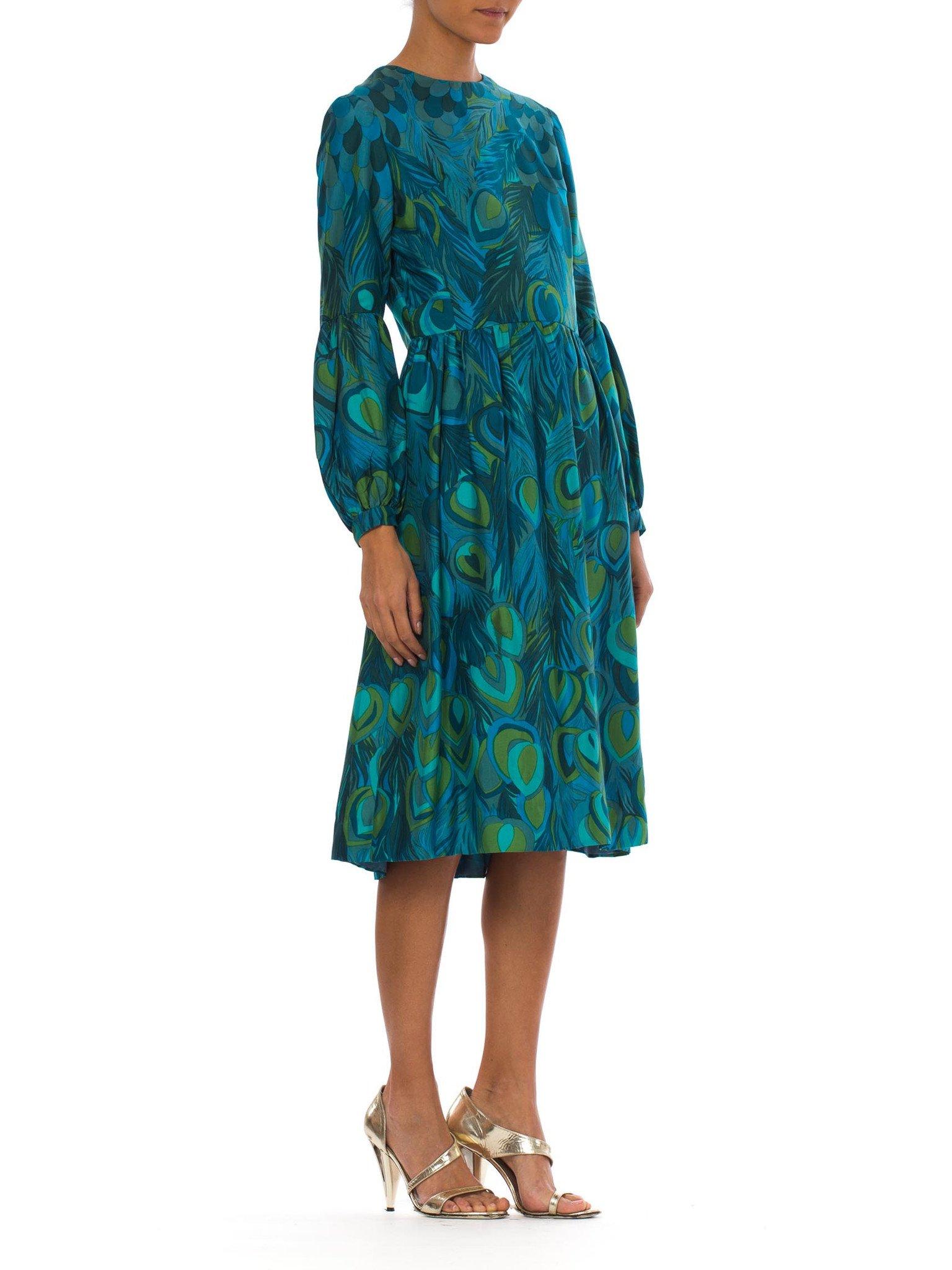 Couture hand finishing throughout and fully lined in beautiful silk. 1960S Teal & Green Silk Twill Hand Printed Peacock Feather Print Long Sleeve Dress 