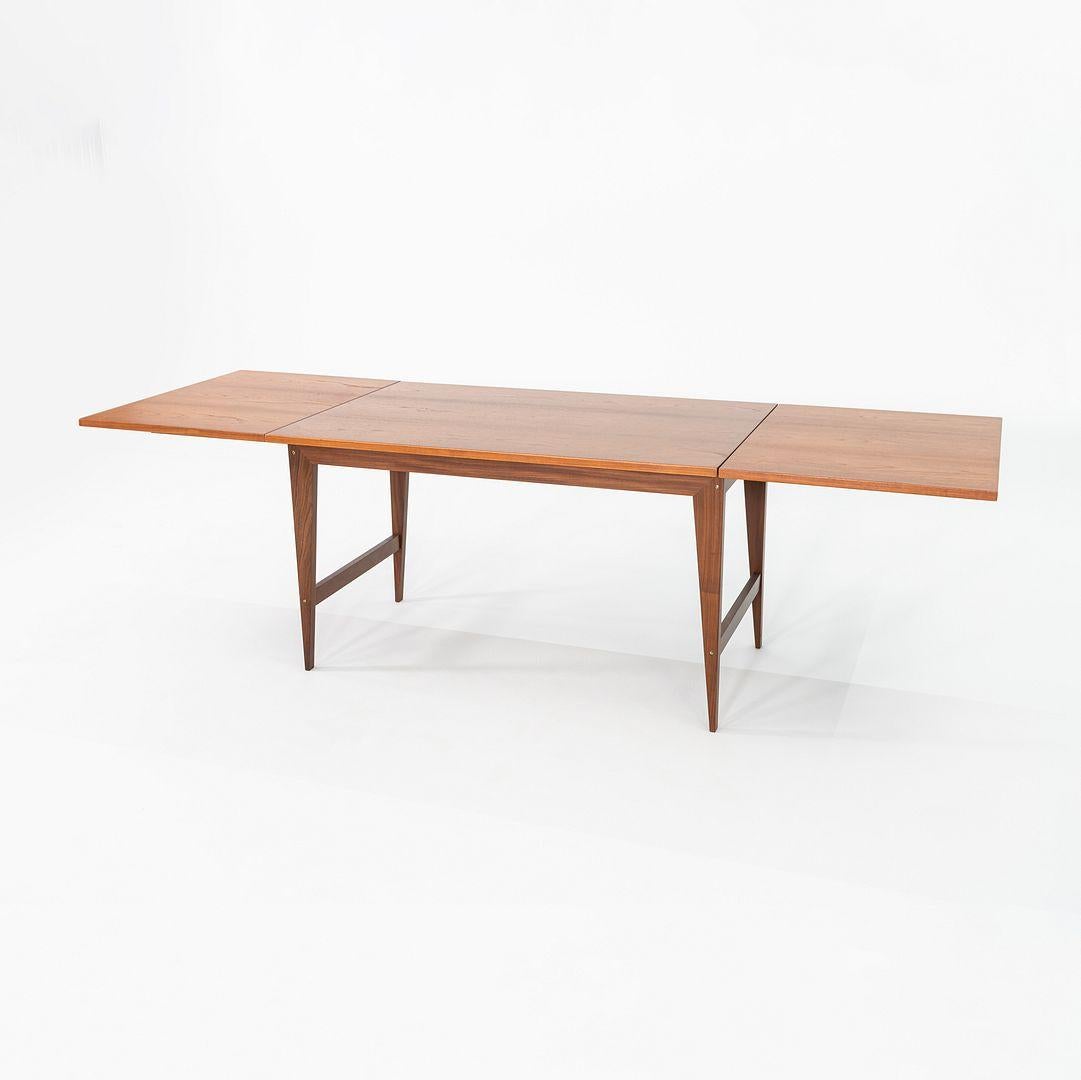 This is a Rectangular Drop-Leaf Dining Table in Teak, designed by Poul Cadovius for Royal System in Denmark in the 1960s. We have had the table freshly refinished, revealing an exquisite grain on the leaves and top. The piece features tapered