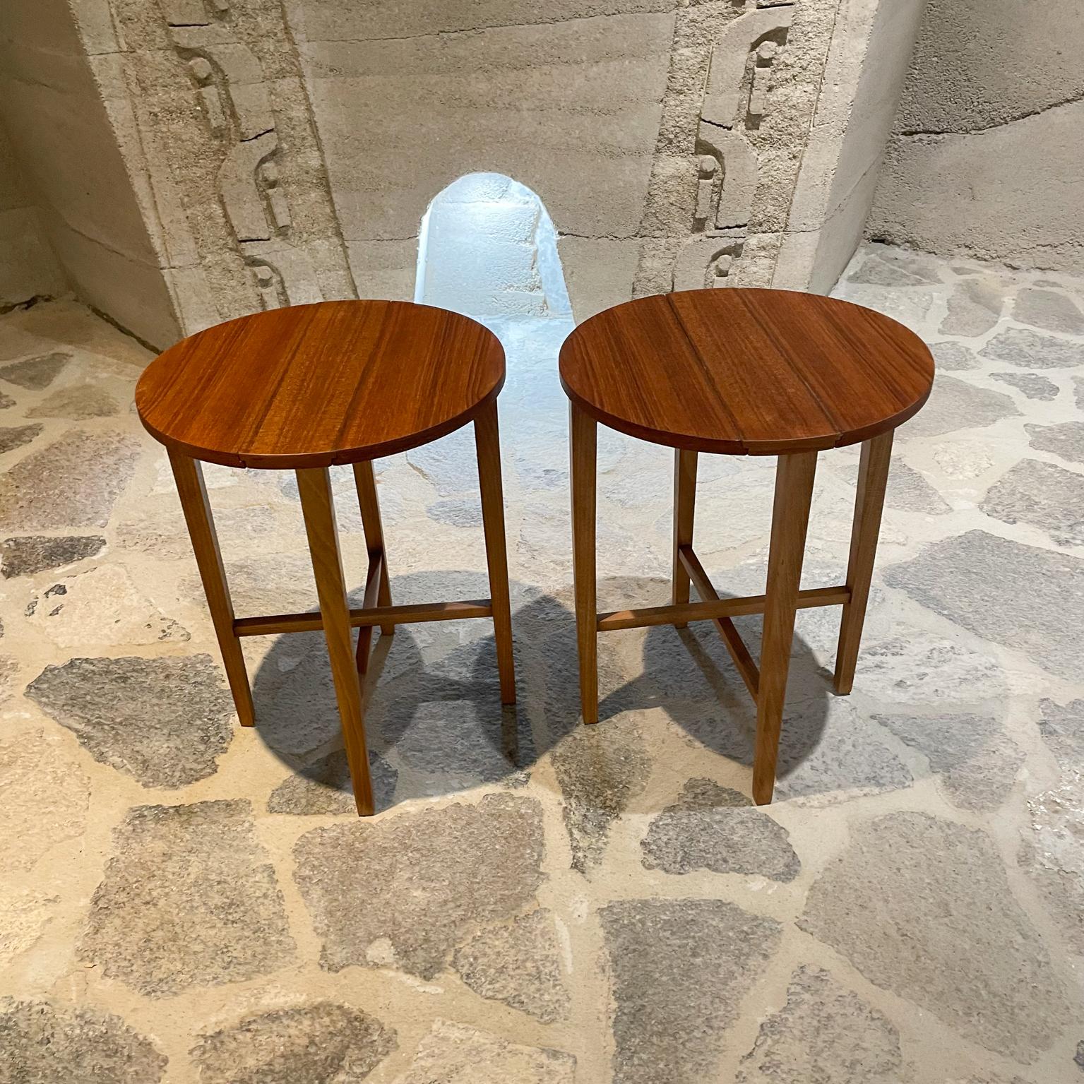 For your consideration: Pair of round side tables Scandinavian Modern Denmark circa 1960s by Danish designer Poul Hundevad.
Teak wood with birch legs. 
Measures: 19.25 height x 15 diameter, 5 x 15 x 19 (folded)
Folding feature for easy shipping