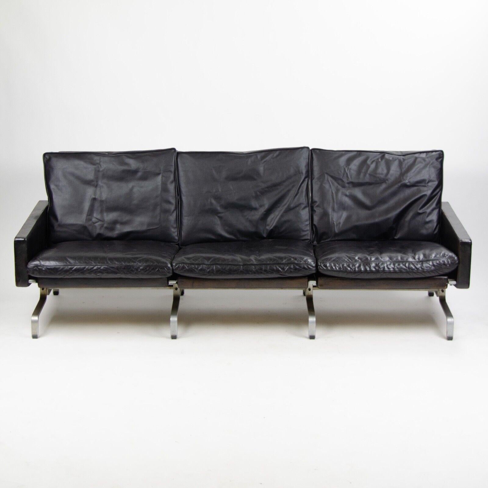 A very rare and quite special three-seater sofa, model PK31 3, designed by Poul Kjaerholm. The piece was produced by E Kold Christensen in Denmark.

This example is upholstered in a beautiful black leather. A lovely patina can be found most