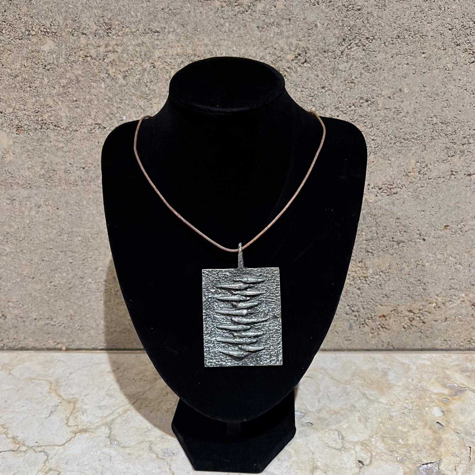 1960s Poul Warmind Brutalist Pendant Textured Pewter
Danish Denmark
Stamped
No chain is included- for illustration only.
3.5 h x 2.25 x .25
Preowned vintage.
Refer to images