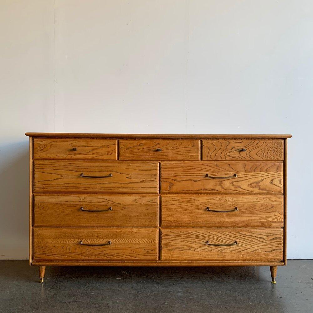 Restored oak dresser with original hardware. Item is structurally sound and shows in great condition.