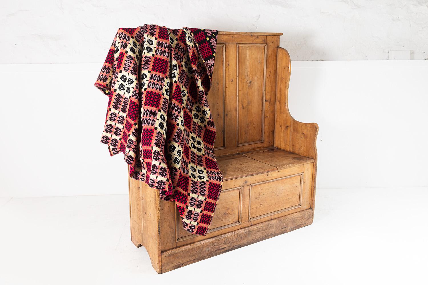 A superb 1960s welsh wool tapestry blanket in a lovely dark colourway with red, yellow and black tones.
A thick, warm, double sided blanket with a stitched edge.
In excellent condition.