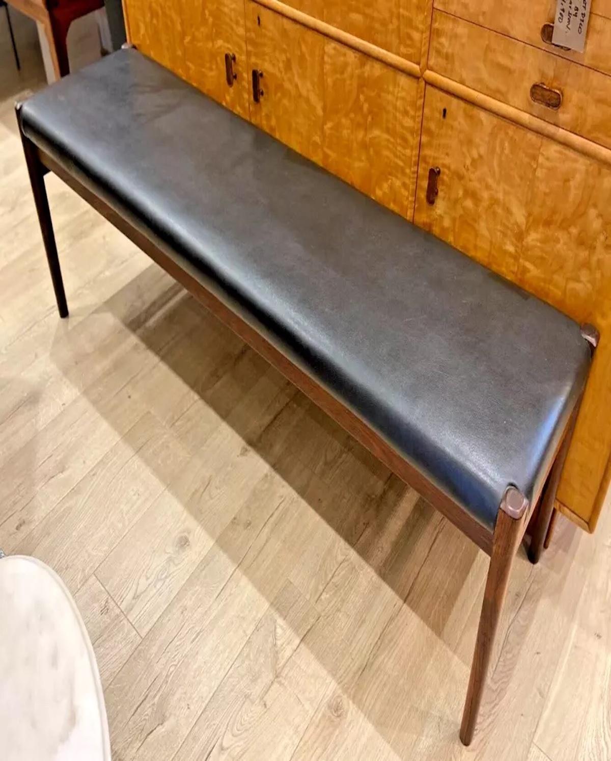 A rare 1960's Danish rosewood bench upholstered in black leather by Niels Otto Moller, a beautiful example of timeless and highly sought after vintage Danish design. 

In amazing vintage condition, the rosewood has a stunning deep