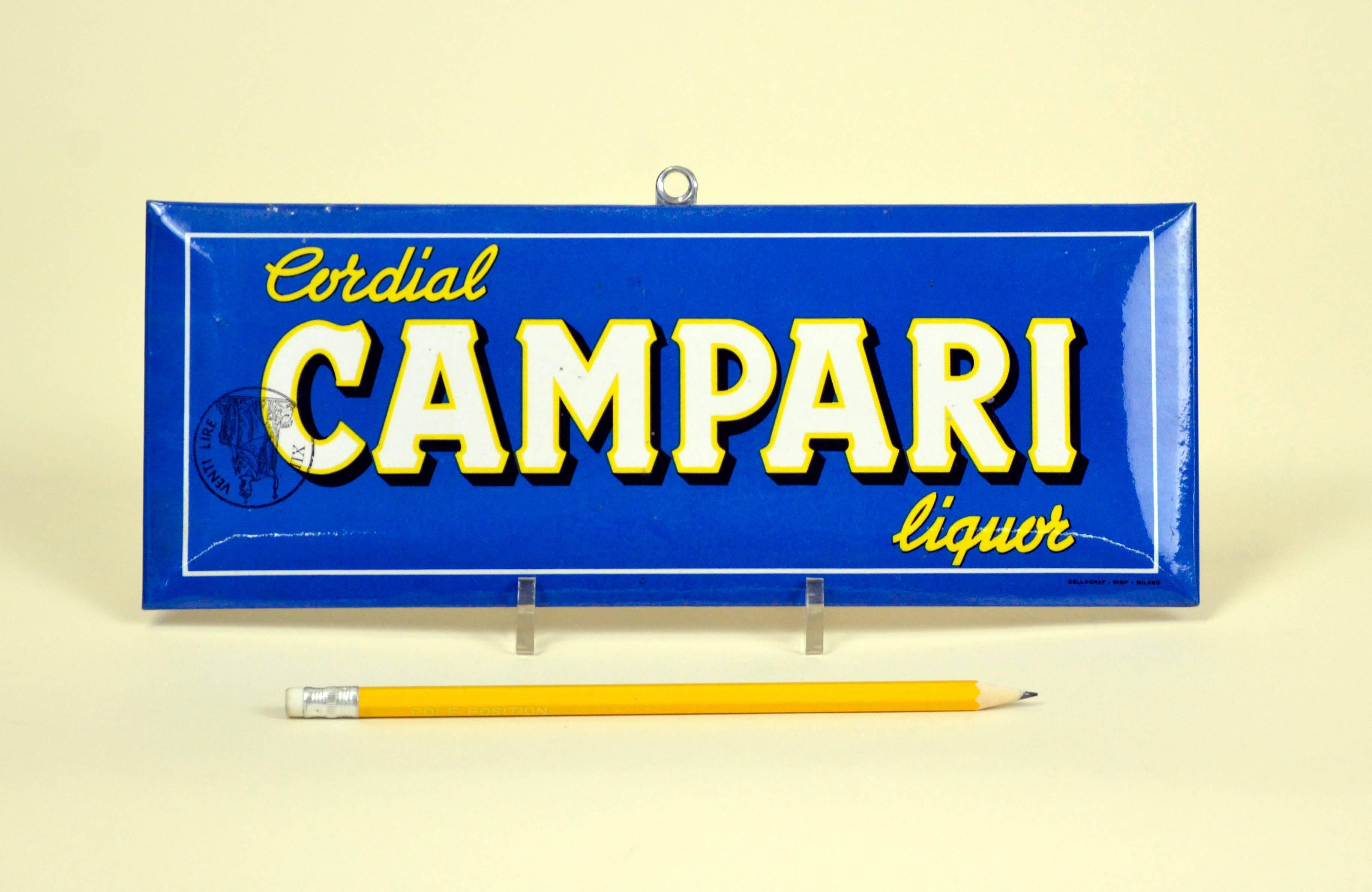 Rare vintage Cordial Campari blue sign with easel back, realized in foil laminated cardboard and made by Cellograf-Simp Milan, Italy in the 1960s.

The sign is slightly curved around the borders.

The sign is also stamped with a black 20 Italian
