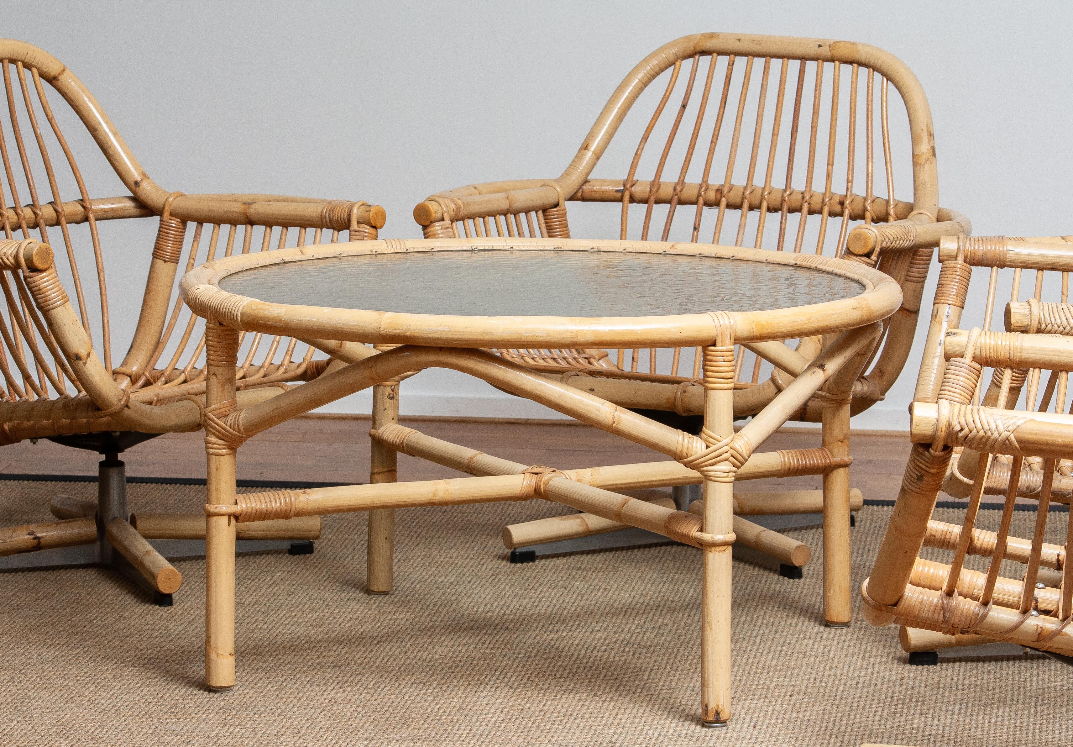 1960s Rattan Garden Set / Lounge Set Consist Five Swivel Chairs and Coffee Table In Good Condition In Silvolde, Gelderland