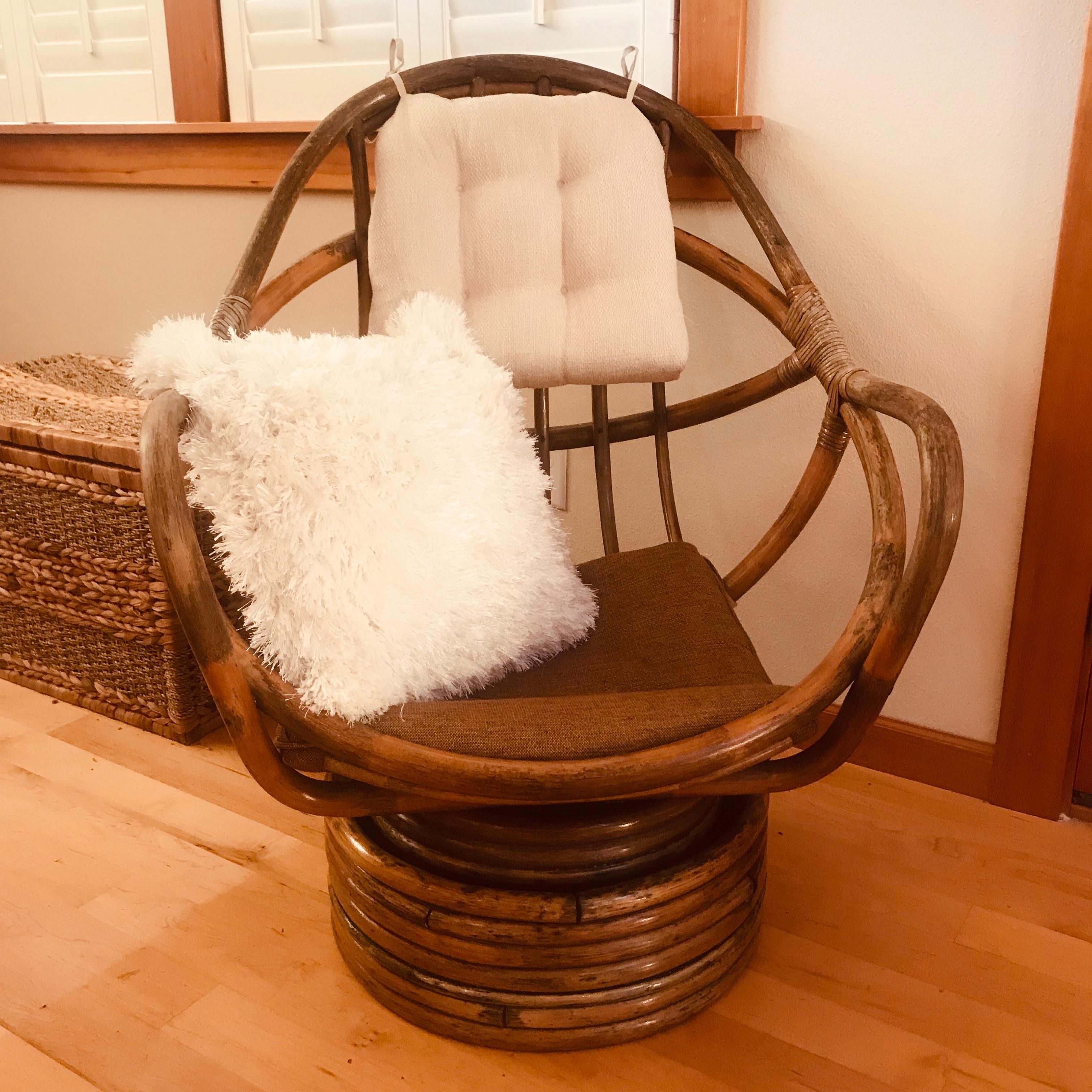 A great 1960s bent pole lounge chair that rocks and swivels. An nice aged patina to the wood. Pictured pillows and cushions come with the chair.