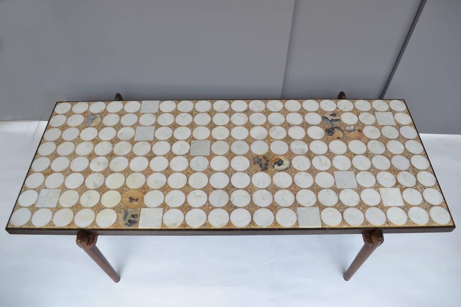 Very rare and sculptural coffee table designed in the 1960s by German Heinz Lilienthal with Carrara marble and onyx circles and squares inlay on a hard wood frame and sculpted legs.
