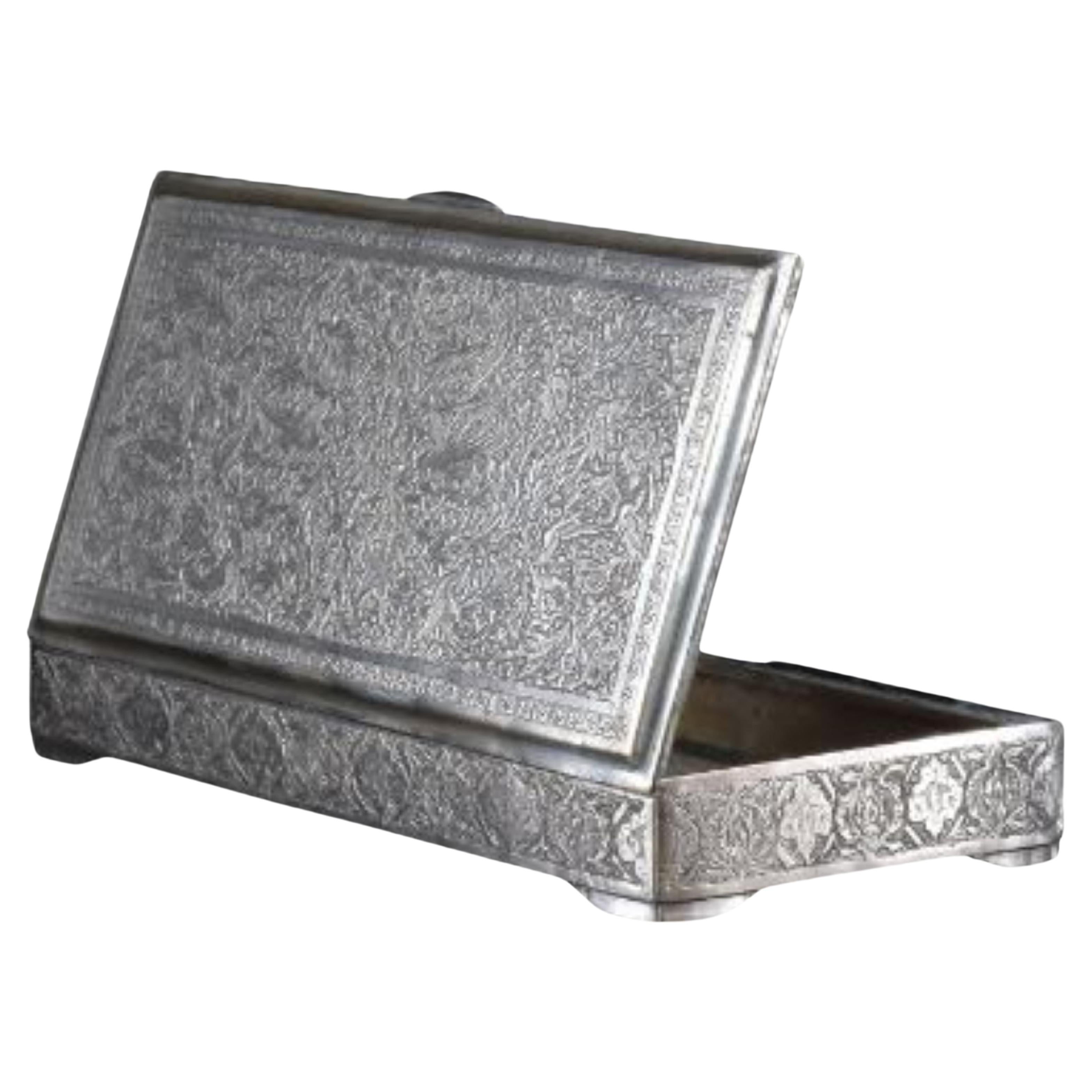 Beautifully handcrafted rectangular sterling silver box with a hinged cover and artisanal engraved ornamental patterns. A perfect gift to hold precious items, or jewellery, or to decorate your interior. 
weight: 403g

----

We are an exhibition