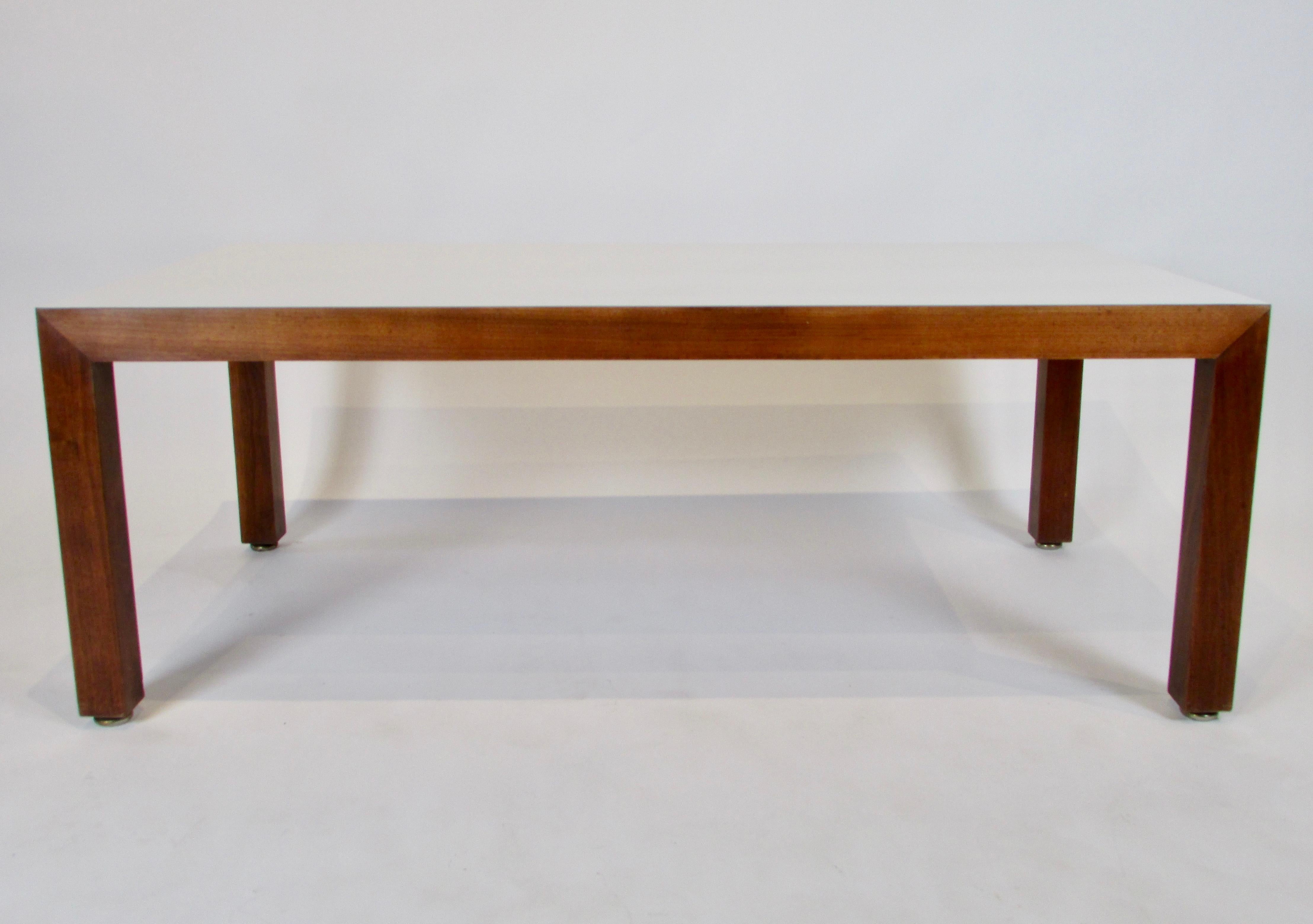 This 1960s era clean-lined rectangular shaped coffee table offers mid-century style with plenty of durable surface area. It is minimal and functional and doesn't shout at you and that is why it's fantastic. Good condition, wear is consistent with