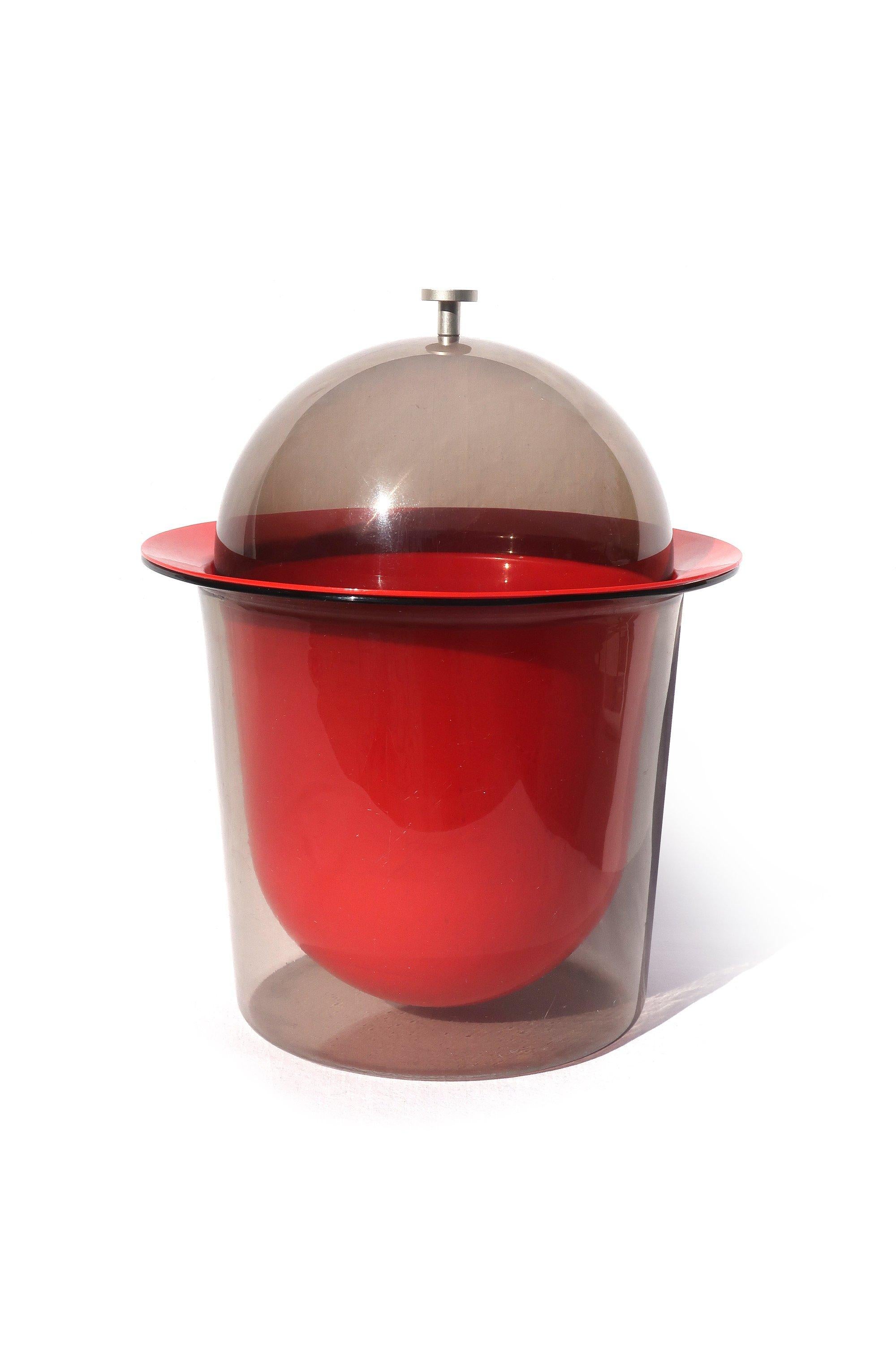 An outstanding Mid-Century Modern smoked acrylic ice bucket with domed lid and red acrylic liner that screams late 1960s/early 1970s
 
Excellent vintage condition with light shelf wear on bottom.
 
10” x 10” x 12.5”.