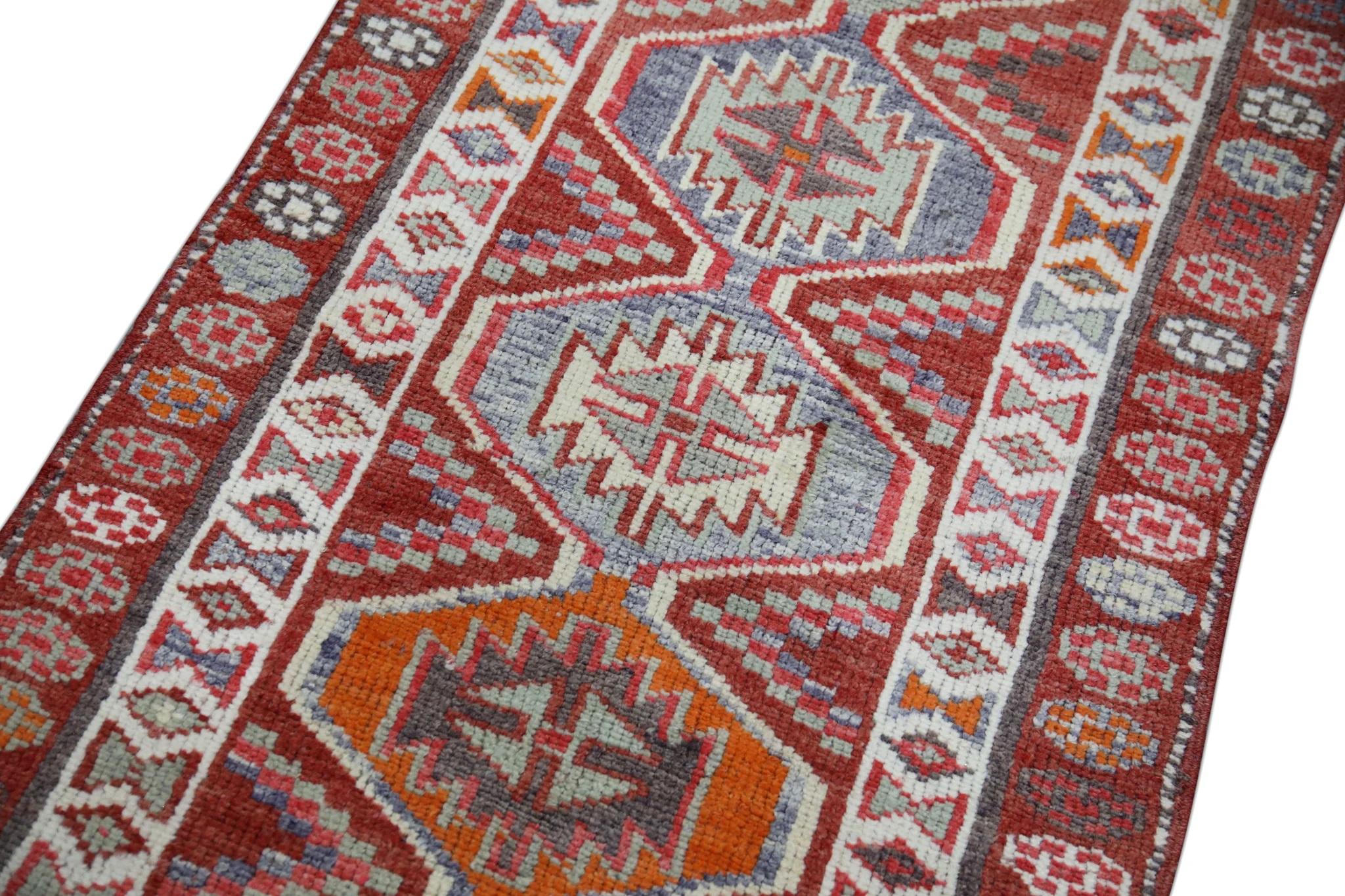 Introducing a one-of-a-kind vintage Turkish hand-knotted wool rug, carefully crafted by skilled artisans using traditional techniques passed down through generations. This exquisite rug boasts a stunning array of natural dyes, resulting in a rich