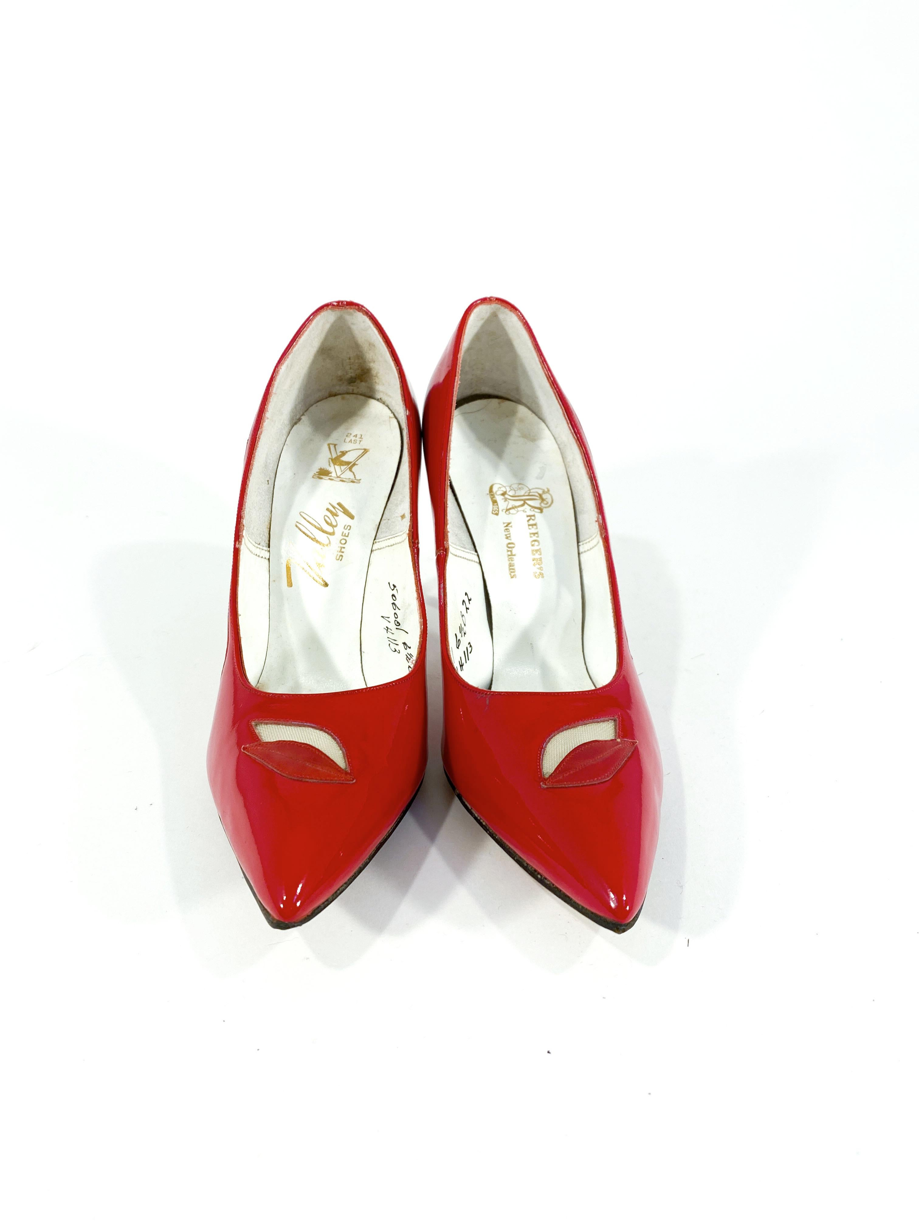 1960s red patent leather stiletto heels with leaf motif cutouts backed in mesh. The toes are pointed and the soles are leather. 