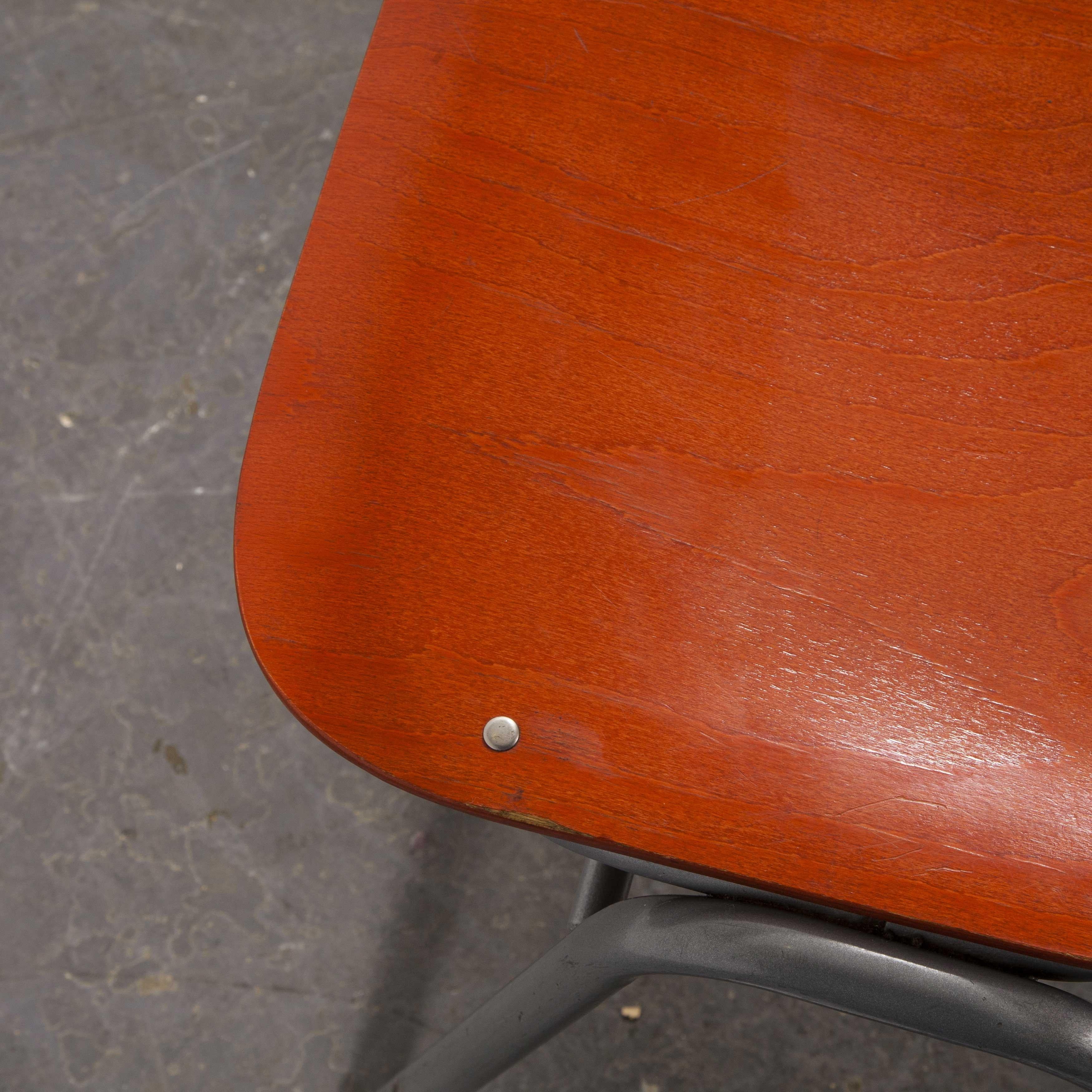 1960s red stacking school - university dining chair - set of six

1960s red stacking school- university dining chair - set of six. Made with shaped birch seat and back on a metal frame. These chairs came from a university in Western Germany. We