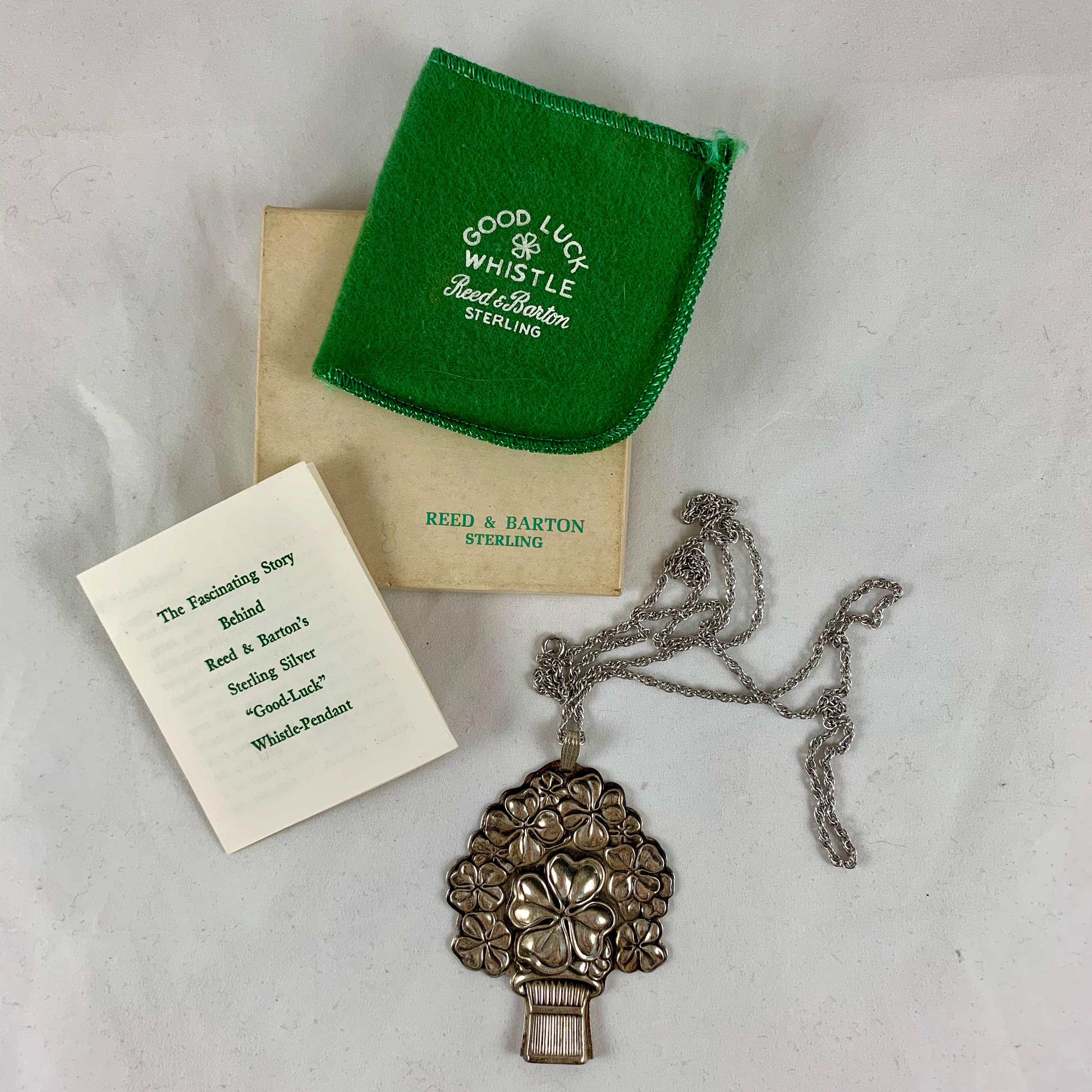 From Reed & Barton silversmiths, a vintage 1960s taxi whistle formed as a bouquet of lucky four-leaf clovers. In the original box with the green fabric storage pouch, the pendant hangs by a bale on a 30 inch long sterling chain.

Also enclosed is