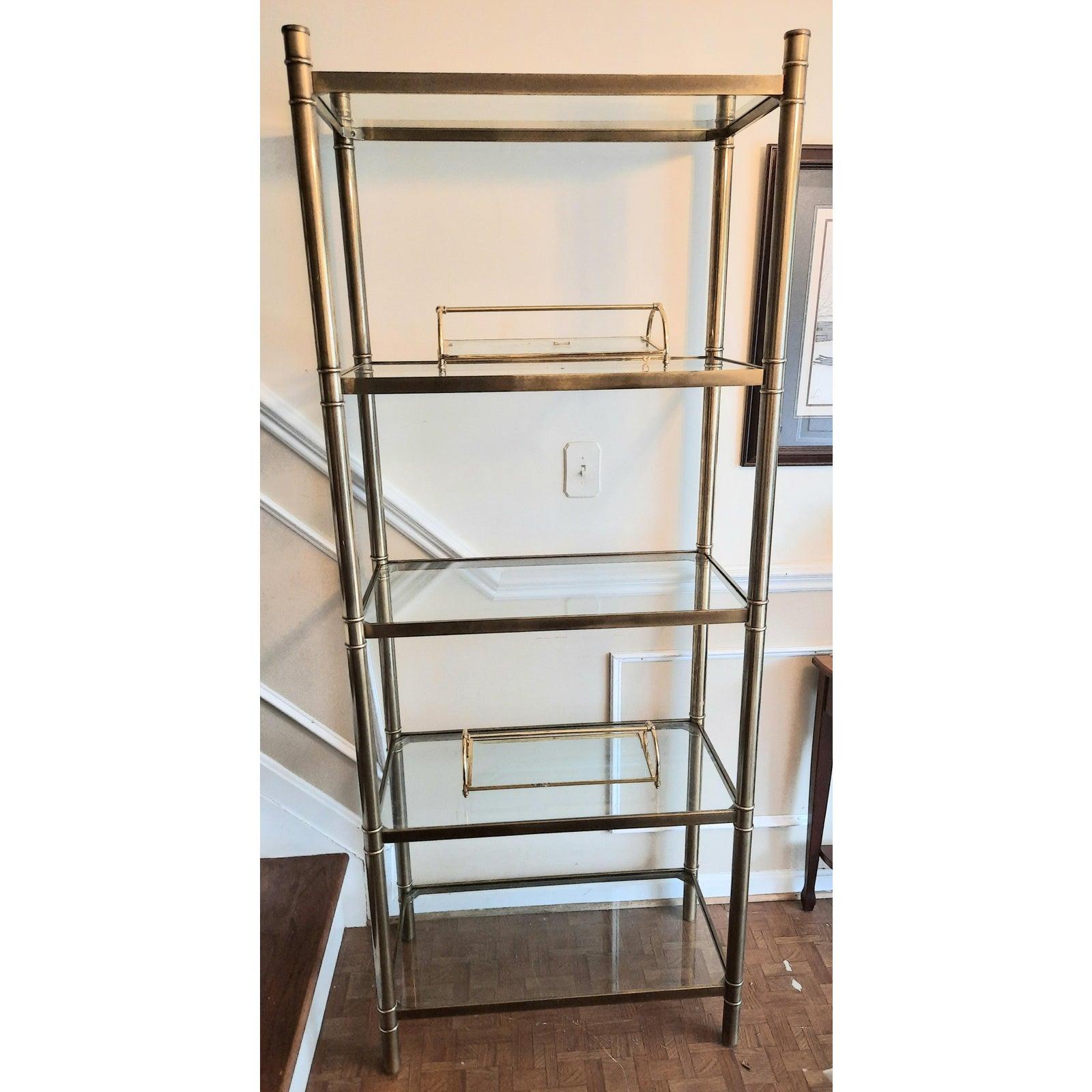 Mid-Century Modern heavy brass etagere bookshelf, display shelf. Real solid brass (130lbs) in excellent condition. 5 glass shelves.
Measures: 38W x 18D x 80H.
 