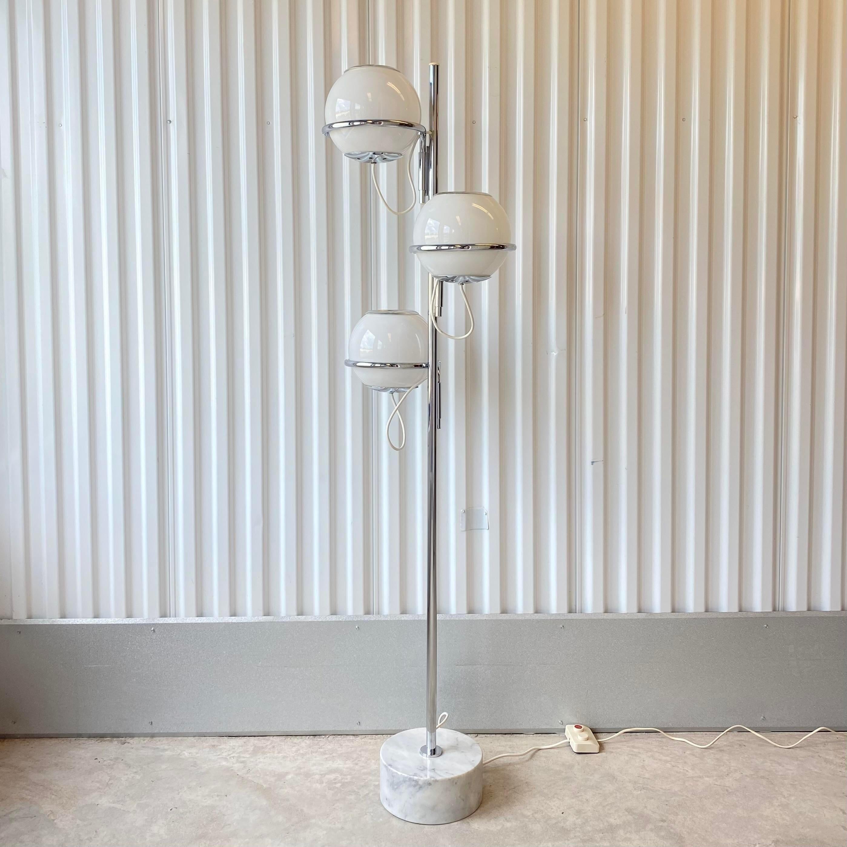 Vintage circa 1960s Italian floor lamp by Goffredo Reggiani.
Each orb has bulbs inside and on the top allowing them to be lit from the inside and top.
Easily position and direct the light in any direction.
The inside and outside lights of the