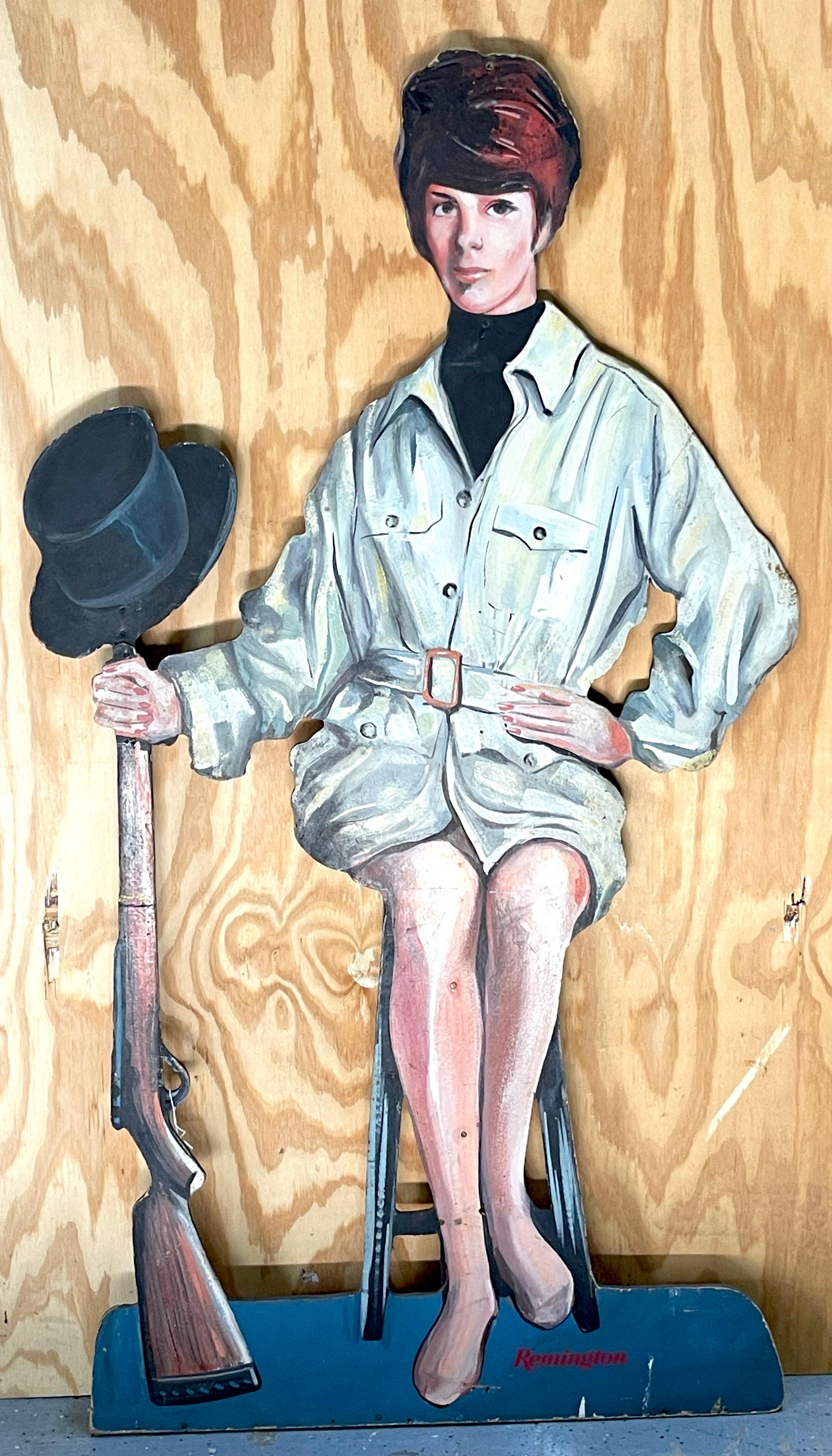 A unique and possibly one-of-a-kind advertising piece from the 1960s, the Remington Rifle Life Size Advertising Dummy Board. This custom store advertising board was created to promote Remington Rifles and features a captivating period 1960s Mod