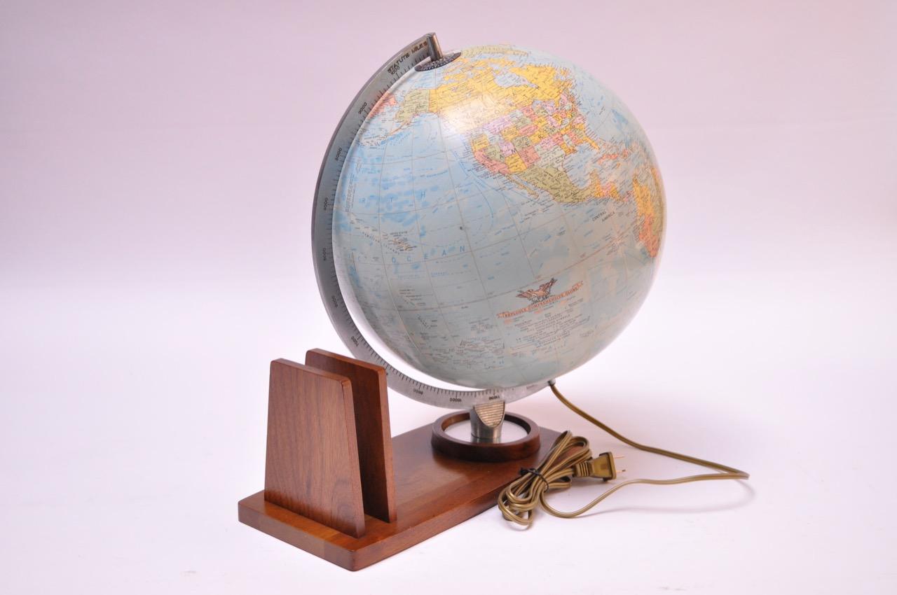 1960s Replogle 'Comprehensive' globe composed of paper gores over plastic with a cast aluminum half-meridian all mounted to a walnut base equipped with two upright dividers for papers, letters, etc. A perfect desk accessory that additionally has a