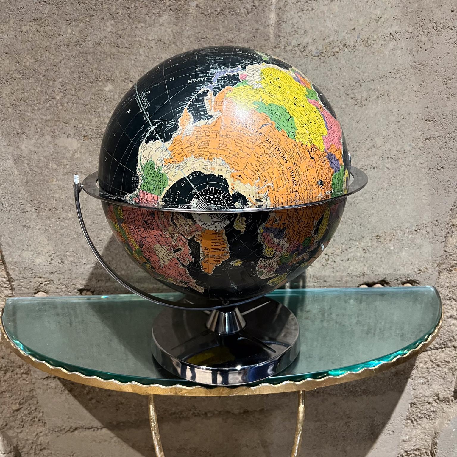 1960s Vintage Replogle Black Ocean World Globe
12 inch starlight globe
made in Chicago
maker stamp
15 h x 13 diameter
Stunning decorative collectible chrome and steel
Preowned original unrestored vintage condition
Refer to images.