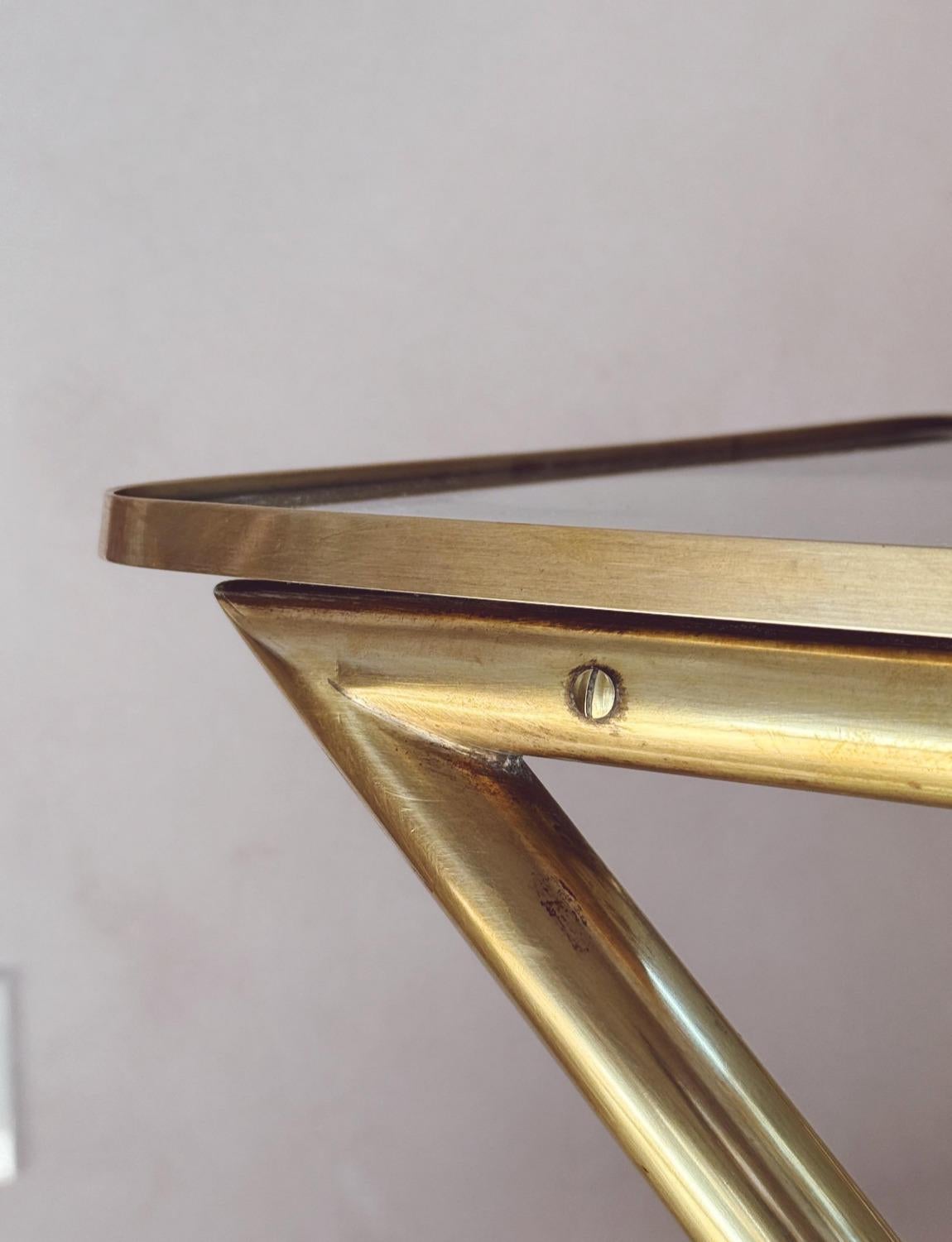 An exceptional wooden and brass drinks trolley created by the designer, Cesare Lacca in the 1960s. We have restored this piece here in Florence bringing life back to its spectacular brass frame and wood. The trolley has three hoops on the bottom