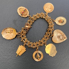 Bracciale vintage degli anni ’60 con ciondoli in oro 14 carati, bracciale di grande effetto con 8 ciondoli