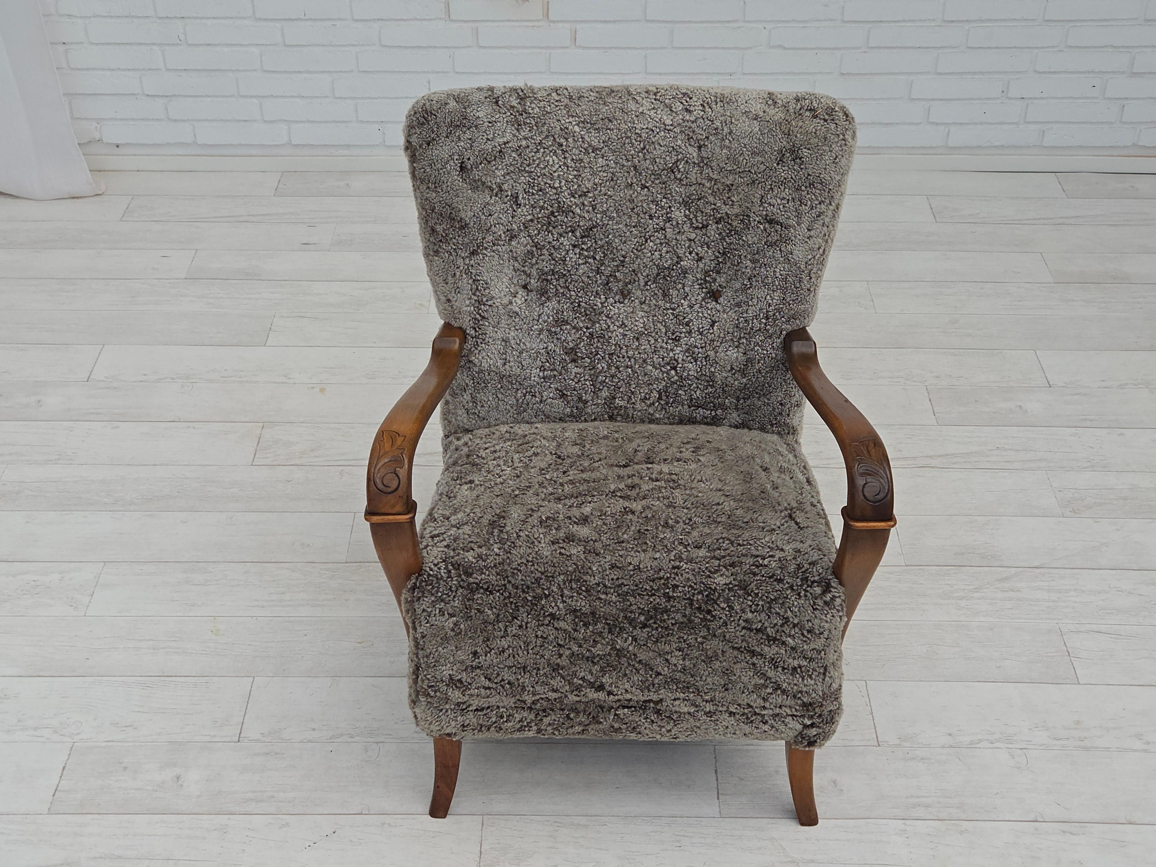 Scandinavian Modern 1960s, reupholstered Danish armchair, New Zealand genuine sheepskin. For Sale
