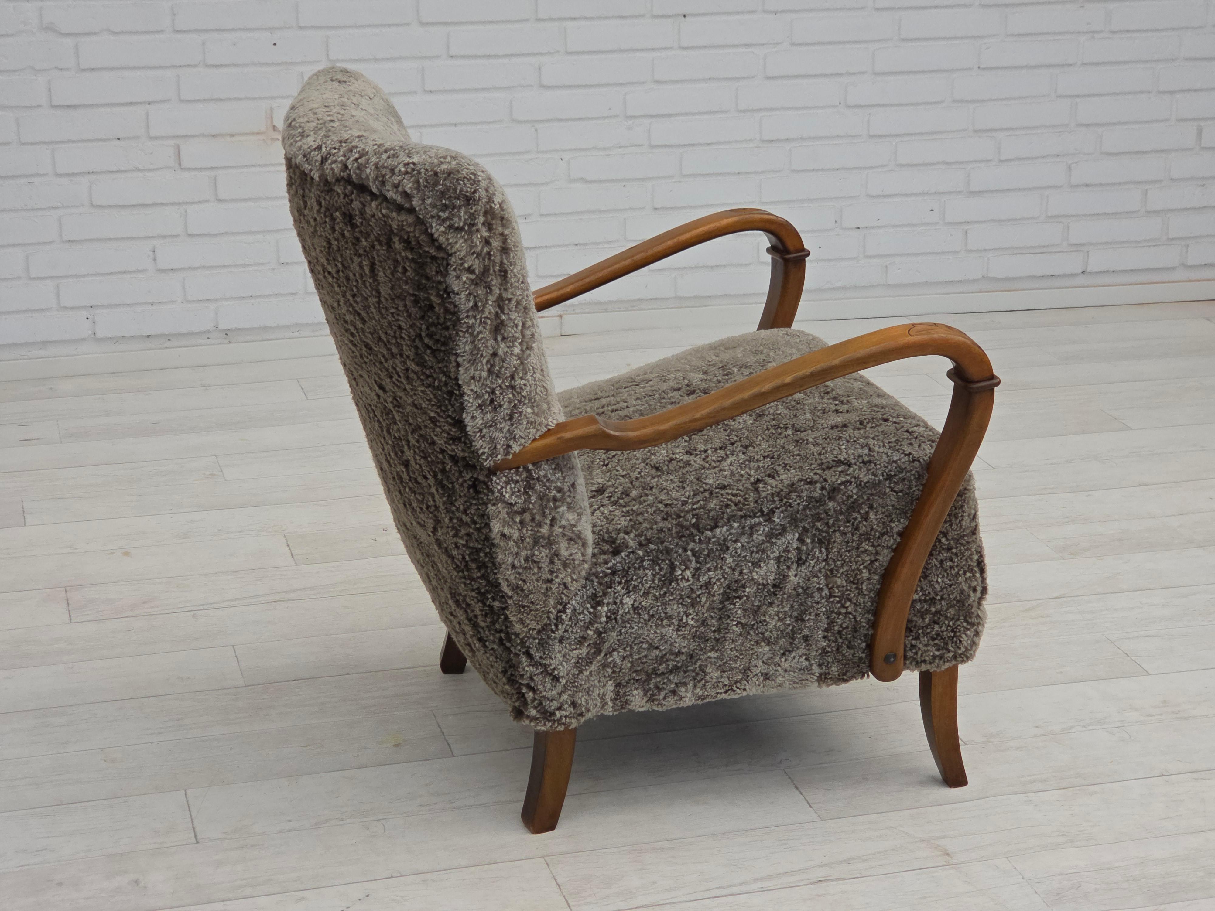 1960s, reupholstered Danish armchair, New Zealand genuine sheepskin. In Good Condition For Sale In Tarm, 82