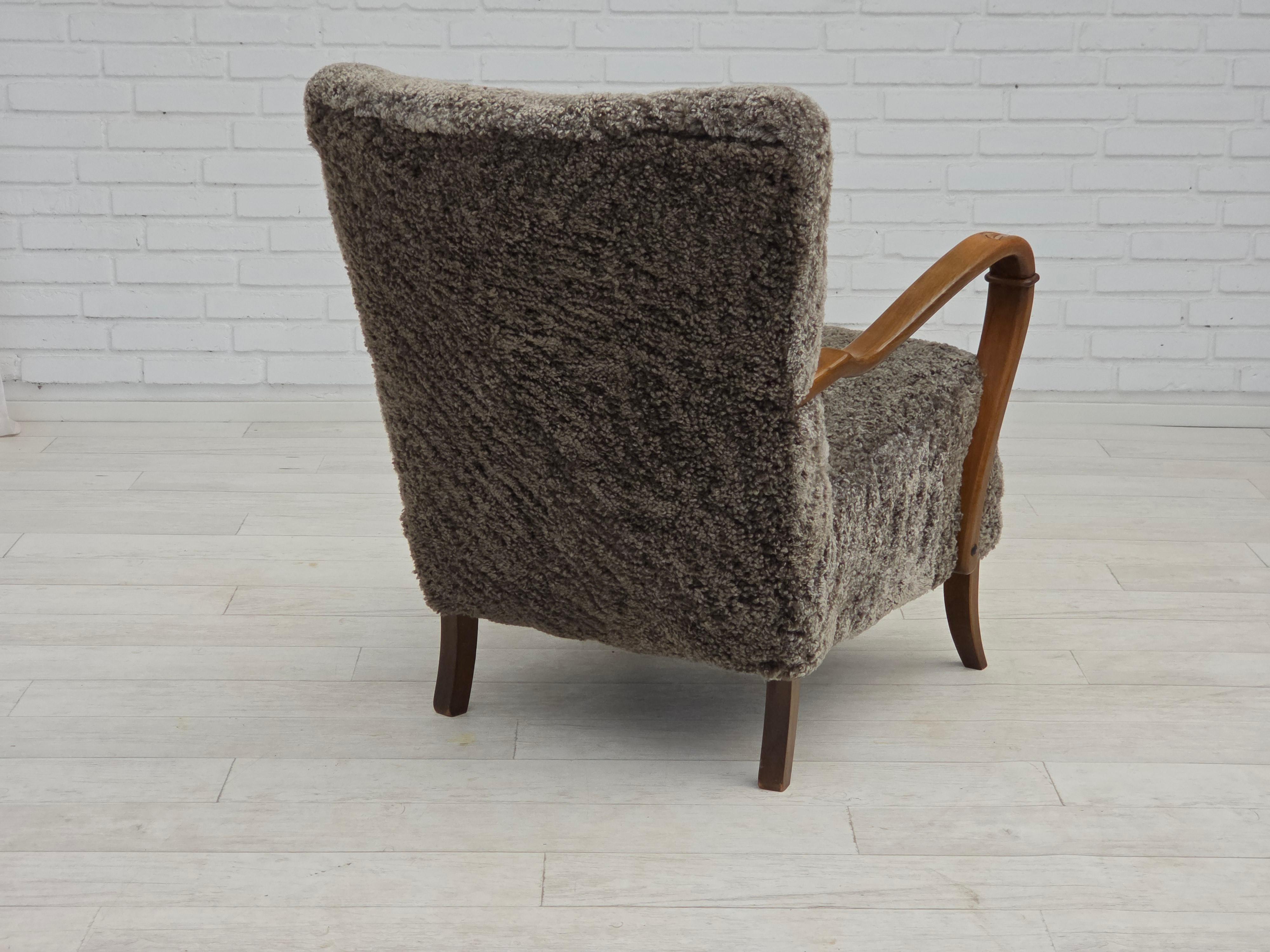 Sheepskin 1960s, reupholstered Danish armchair, New Zealand genuine sheepskin. For Sale