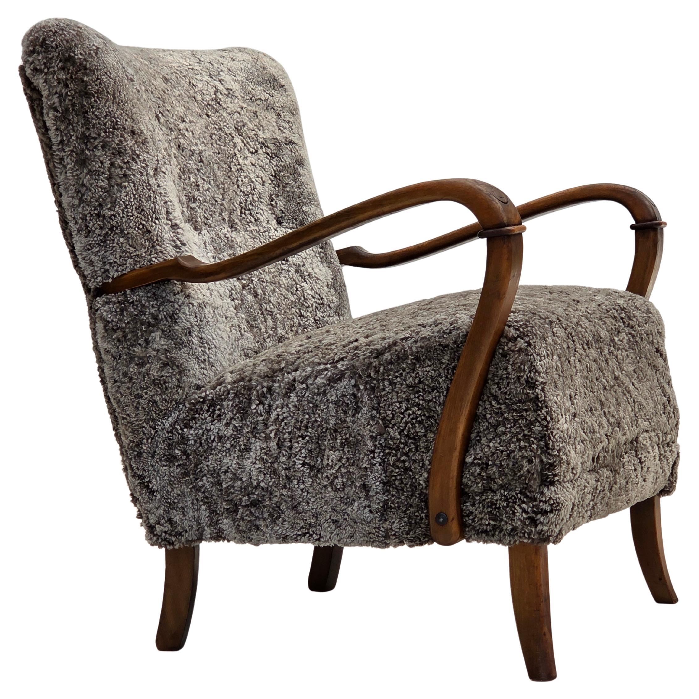 1960s, reupholstered Danish armchair, New Zealand genuine sheepskin.