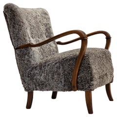 1960s, reupholstered Danish armchair, New Zealand genuine sheepskin.