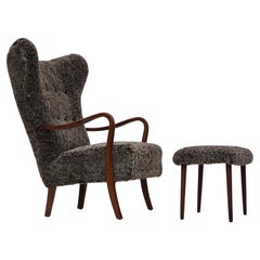 Vintage 1960s, reupholstered Danish armchair, stool, genuine sheepskin "Wellington".