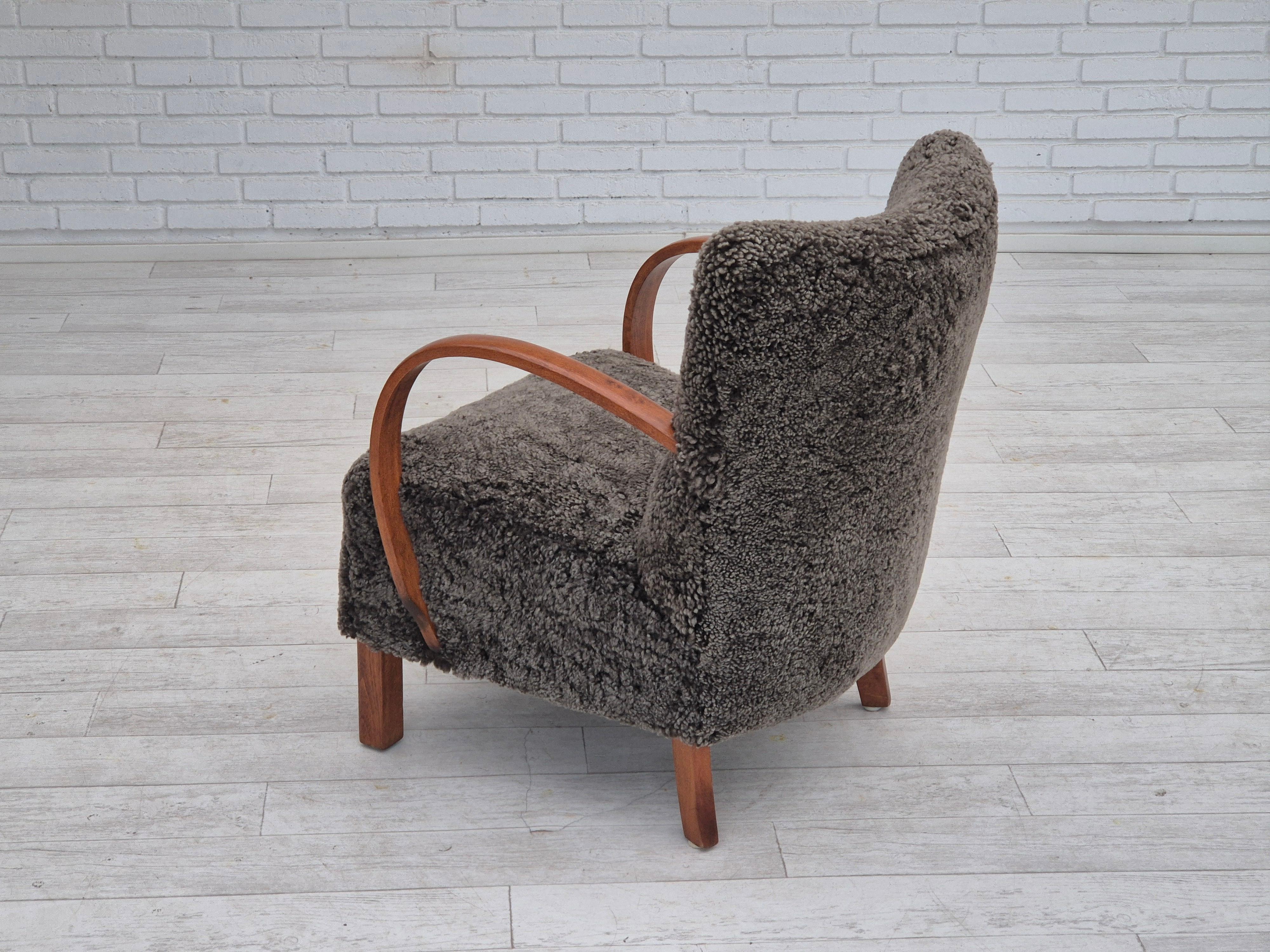 Sheepskin 1960s, reupholstered Danish art deco armchair, genuine New Zealand sheepskin. For Sale