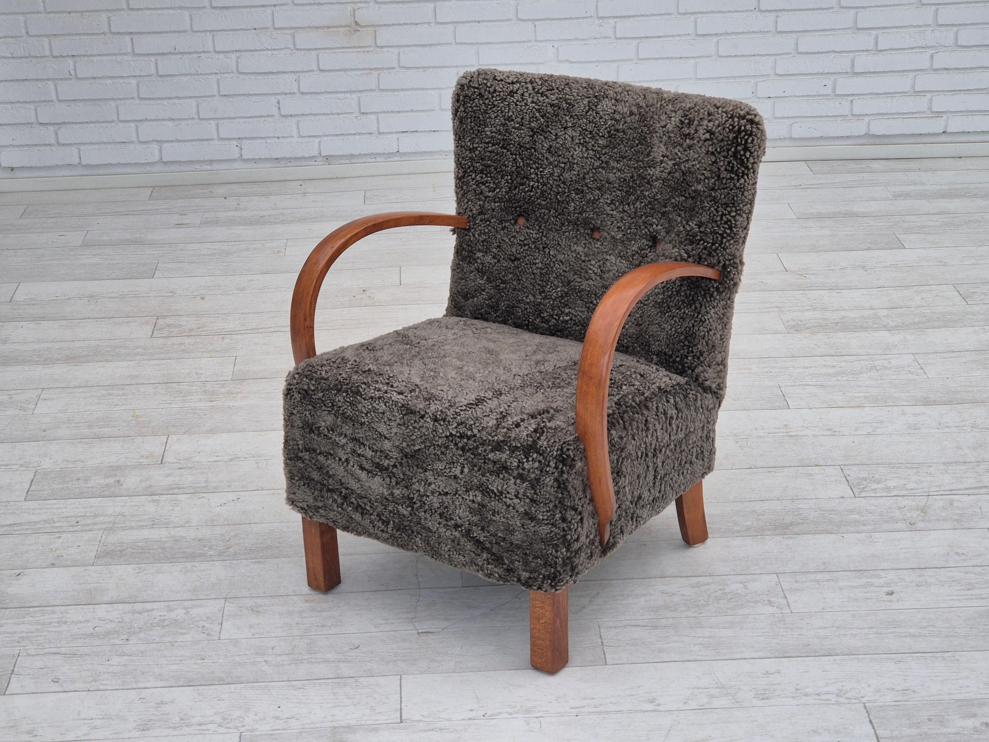 1960s, reupholstered Danish art deco armchair, genuine New Zealand sheepskin. For Sale 1