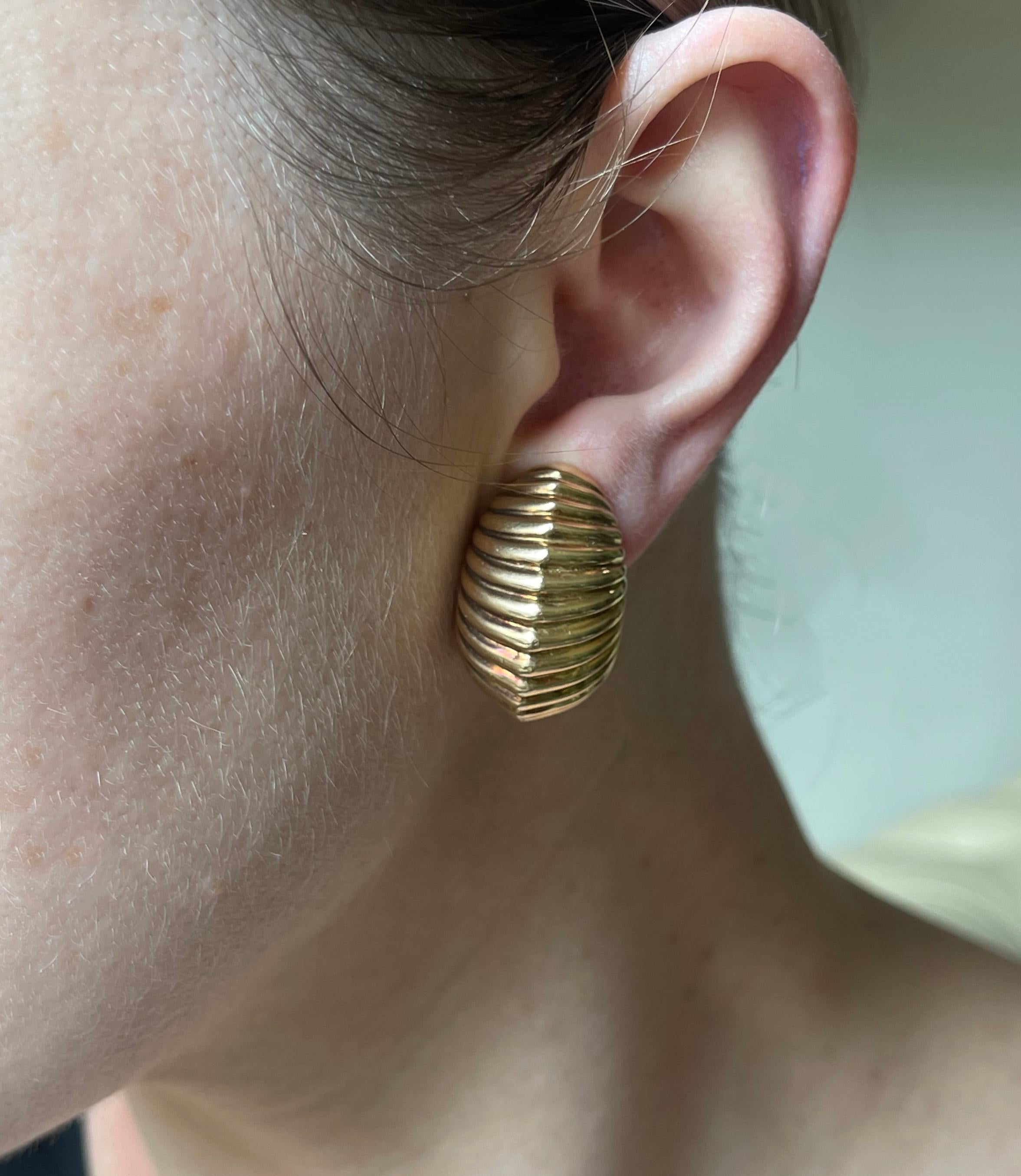 Pair of vintage, circa 1960s 14k gold ribbed design half hoop earrings. Measure 1