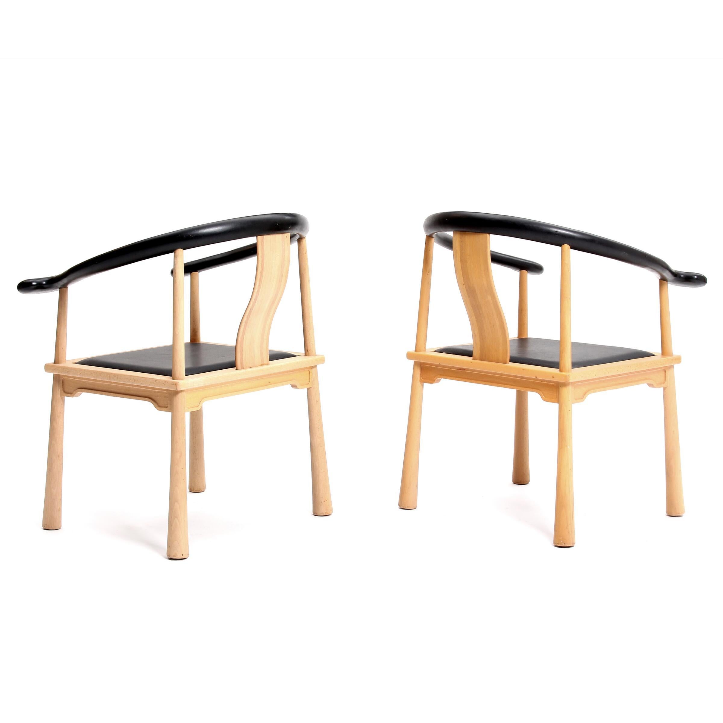A pair of 1960s Richard Nissen “Yin” beech China chairs with club shaped legs, loose seat with black Leather. The armchair is made from an old Chinese principle. The top rail is made from a total of six parts with wedges. Total production of the