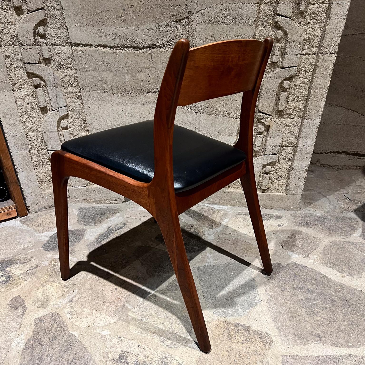 1960s by Richbilt MFG Two Danish Modern Dining Chairs 
in the Style of Johannes Andersen
Cincinnati Ohio
Retains original label
30.25 h x 21 d x 20.25 w Seat 19.25 h
Black Vinyl on Walnut Wood
Exceptional Craft
Preowned original vintage