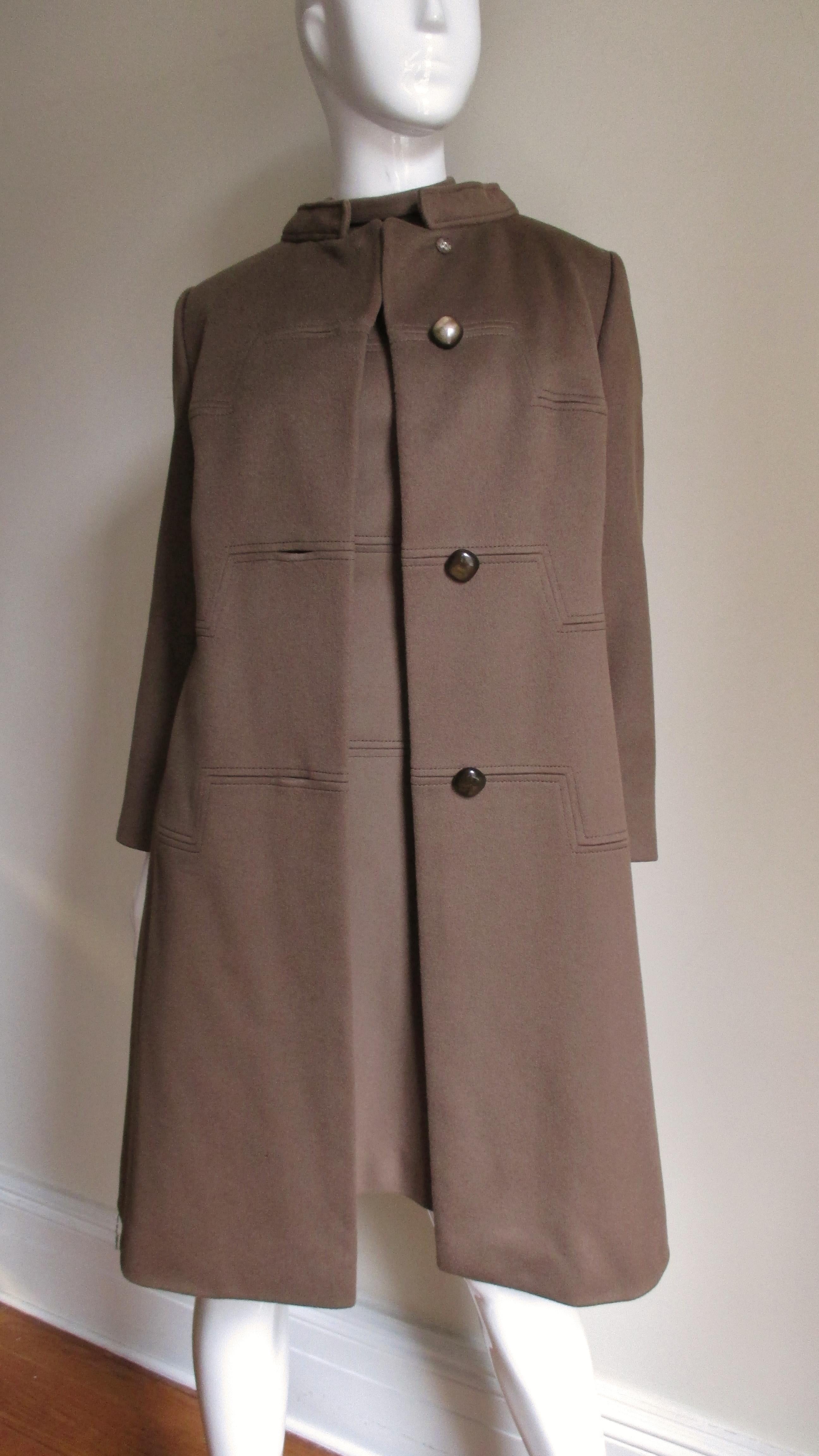 A gorgeous 1960s dress and coat set in brown cashmere made by Rike's, Switzerland for upscale Dayton's Department store. The A line dress has short sleeves, a stand up collar and three horizontal squared seams- one across the front bust, waist and