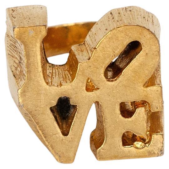 Gorgeous 1960s Robert Indiana modernist sculptural love ring

Ring size: US 4.25

Approximate Measurements:
Ring Top - 19mm x 19.7mm

Hallmark: NA
