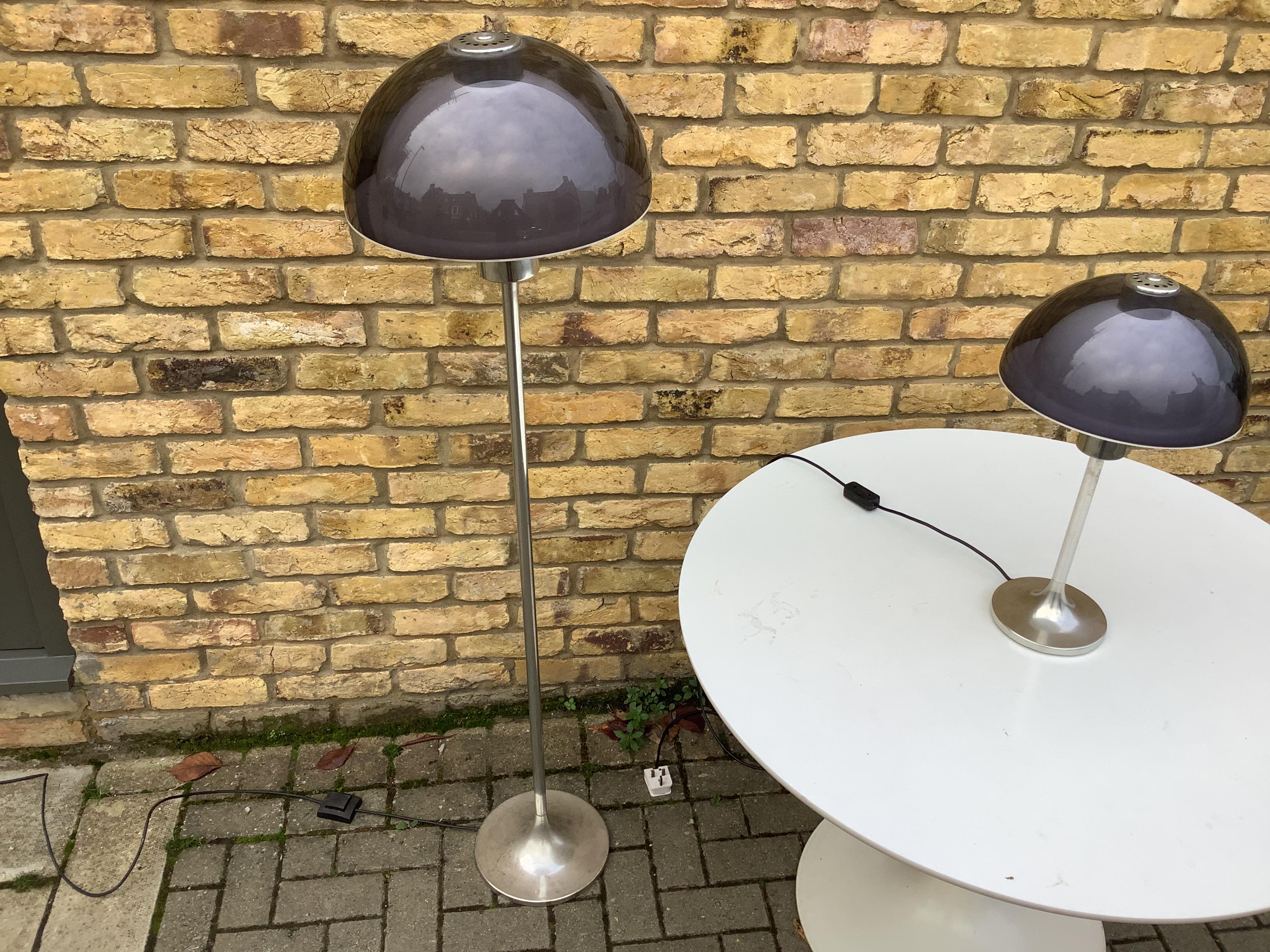 A rare large table lamp and standing lamp Designed in 1966 by Robert Welch and manufactured by Lumitron, UK. Inner plastic diffuser of white with outer dome of purple acrylic. Polished aluminium base and stem.
  