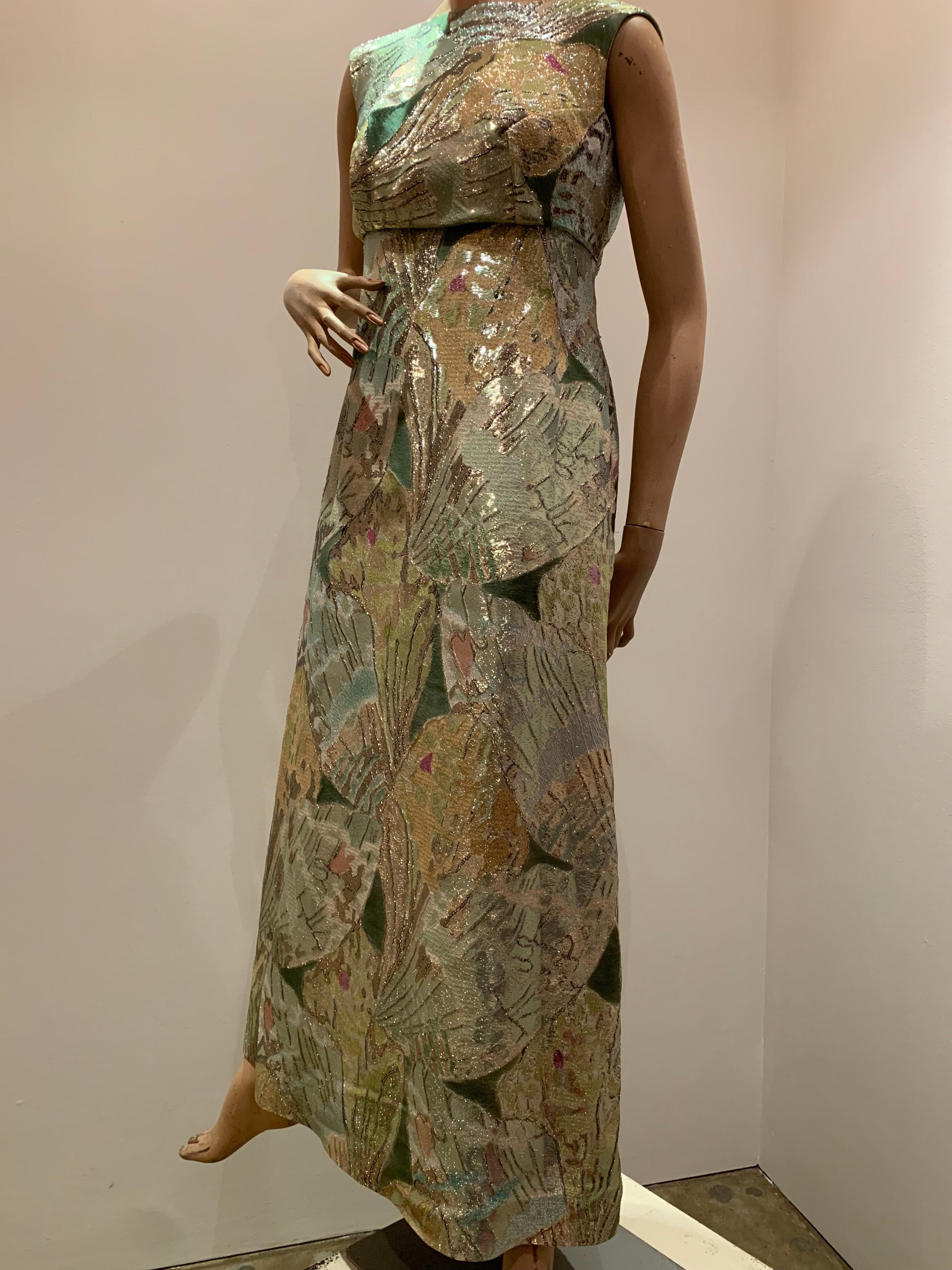 1960s Rochá  Butterfly Wing Patterned Lamé Brocade Empire Evening Gown. Really spectacular fabric and a low dipping back accented with a bow. Fully lined with zippered back. Fits a generous bust.