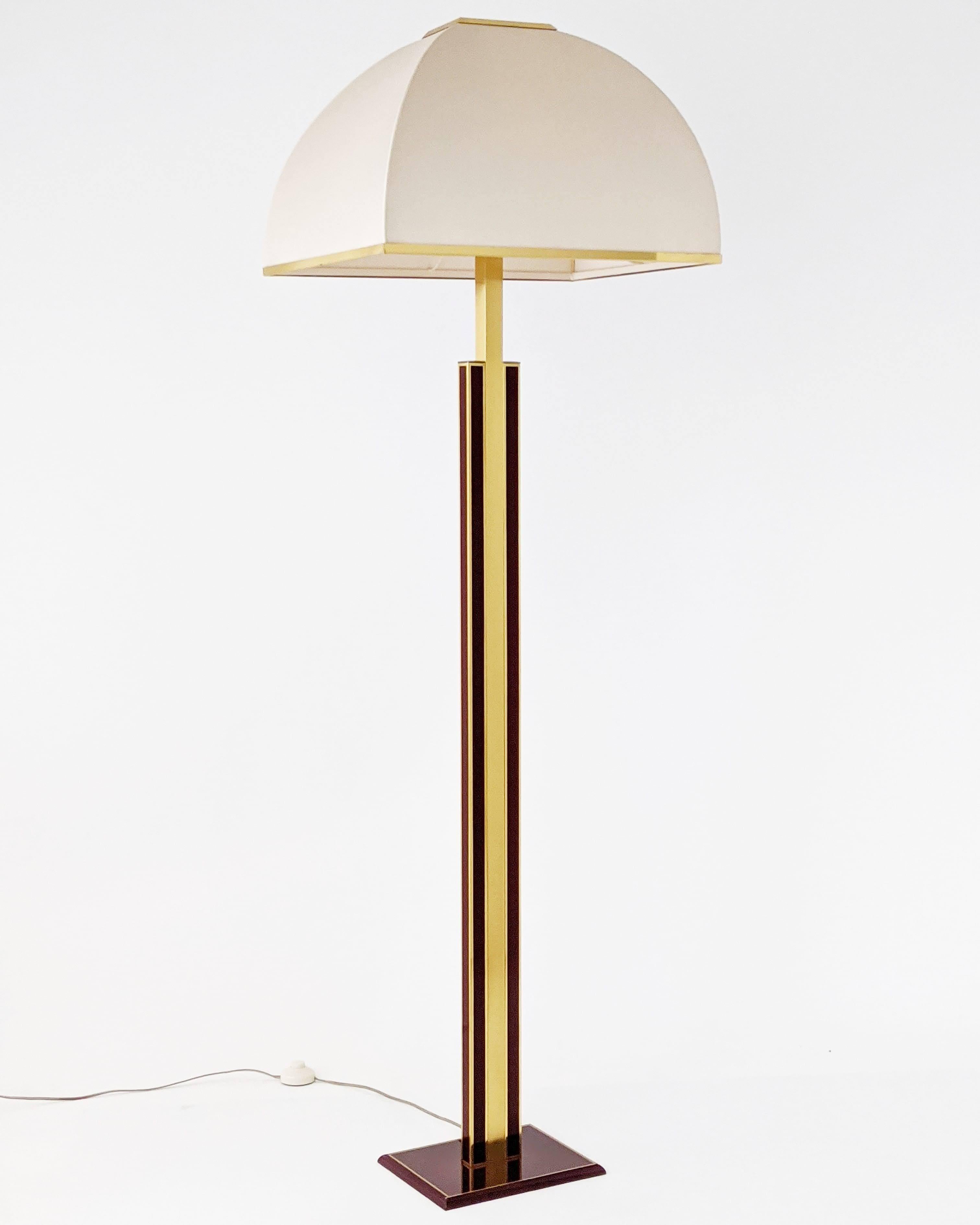 Rare, elegant Romeo Rega floor lamp made of thick brass with original beige fabric washable shade.

Prime quality material, well made with superb attention to detail.

Enameled in a dark red tone with a high gloss lacquered finish.

Shade