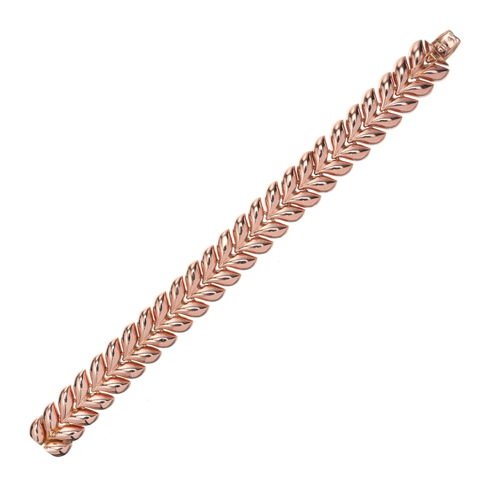 1960's hinged link rose gold bracelet with European hallmarks. Hidden clasp. 7.5 inches long. On a rose gold scale, this leave design style would measure a 9 out of 10. 

14k Rose Gold
30 grams
Tested: 14k
Stamped: 585
Hallmark: European
Length: 7.5