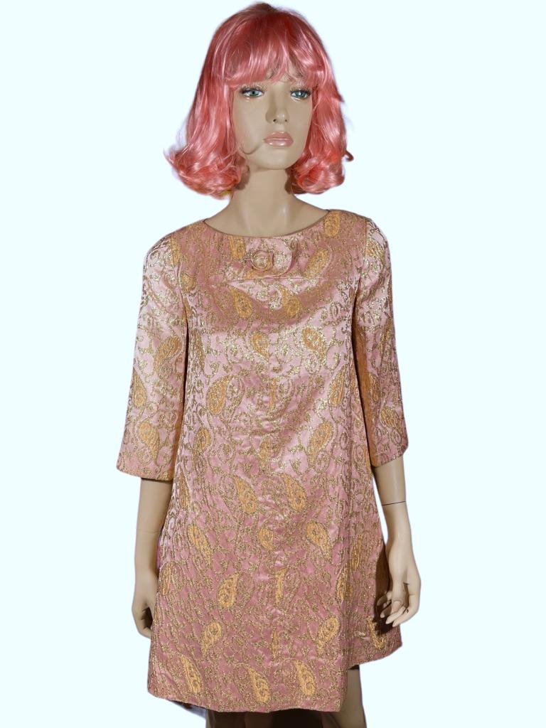 This is an iconic 1960’s A-line empire-waist mini dress designed by Danish designer Ole Borden. Borden designed for the well-known fashion label REMBRANDT from 1964-1974. Reminiscent of the Jackie-O style dress, it is made of a luxurious pale pink