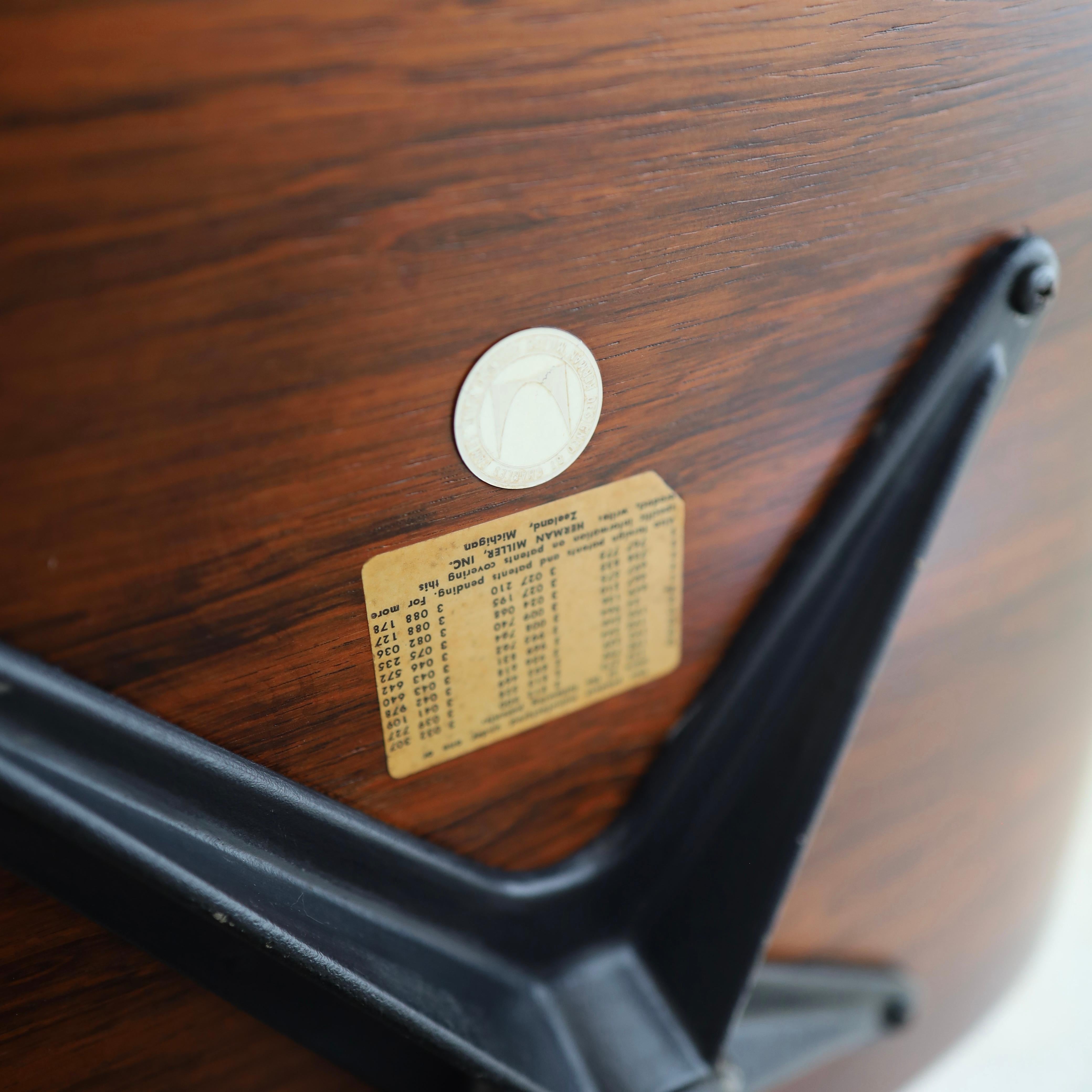 fully refinished but featuring its’ original leather, signed. This piece has been meticulously restored but does have two filled drill marks, wear on the leather, and a loose zipper seam. See photos for details 

